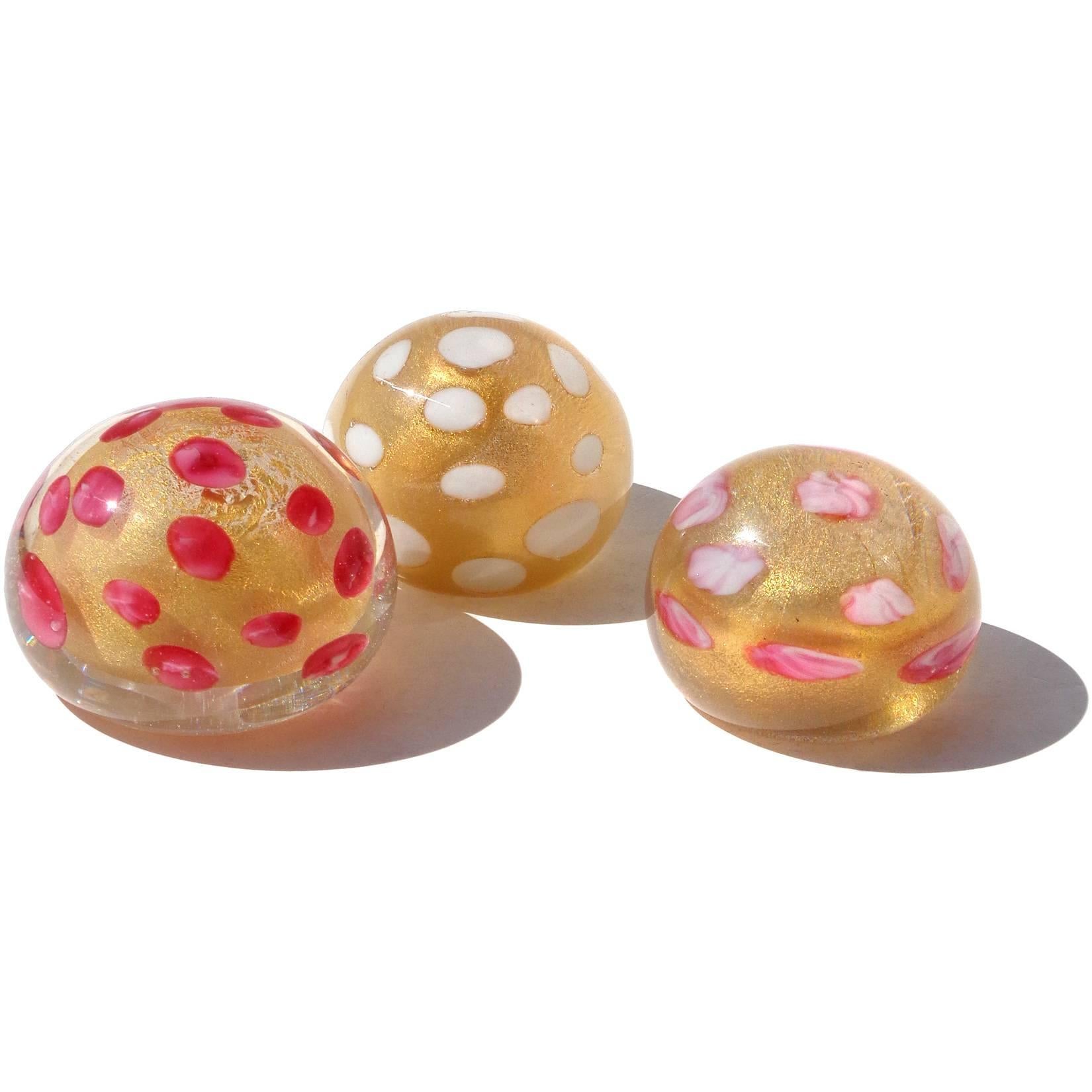 Free shipping worldwide! See details below description.

Beautiful set of three Murano handblown gold flecks art glass paperweights with color spots. Documented to the Barovier e Toso company, in rich dark pink, white, and pink swirl spots.