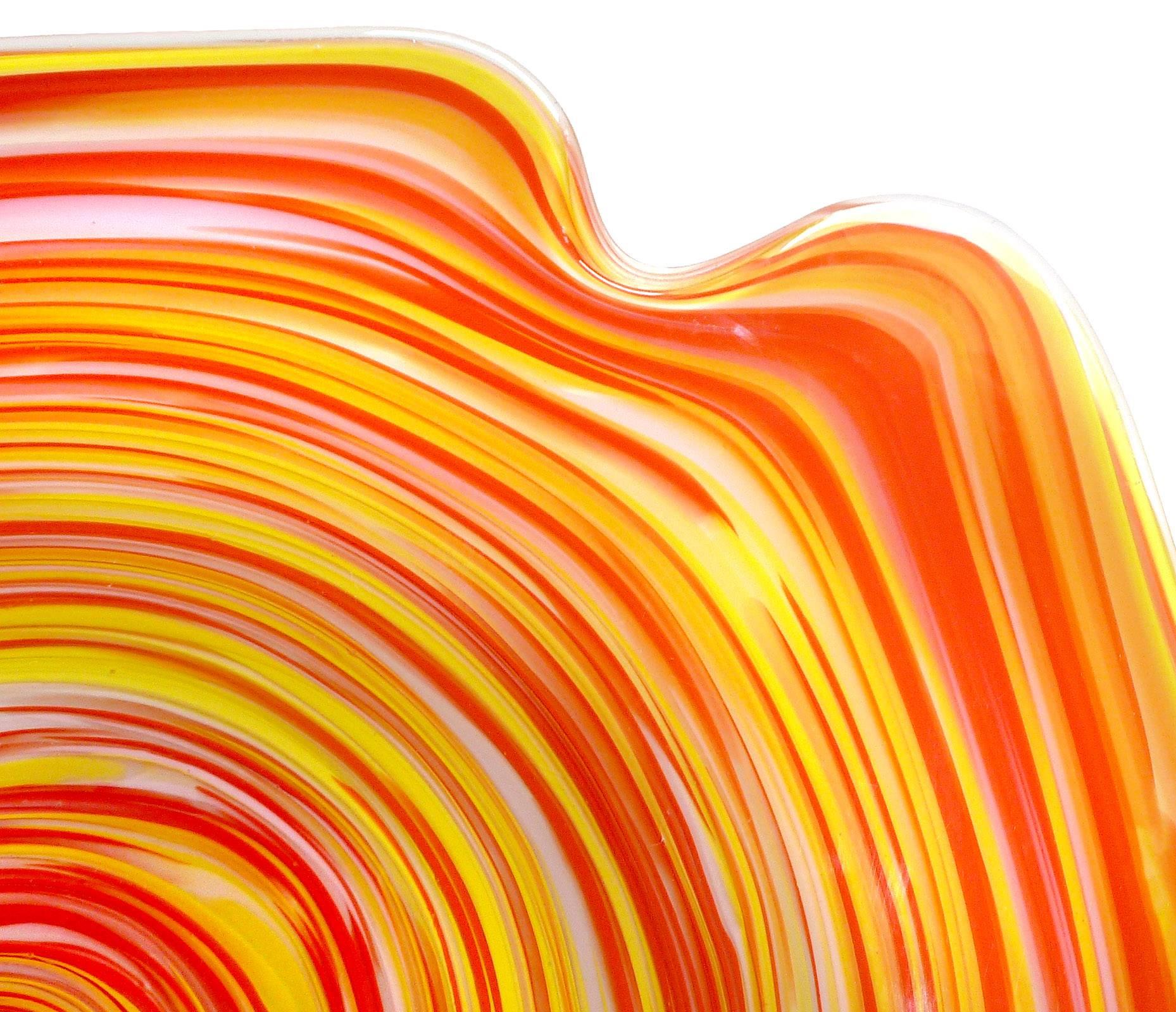 Free shipping worldwide! See details below description.

Bright and beautiful Murano opalescent white, yellow and orange optic swirl art glass centerpiece bowl. Documented to the Fratelli Toso company, in a striking Psychedelic design. It still