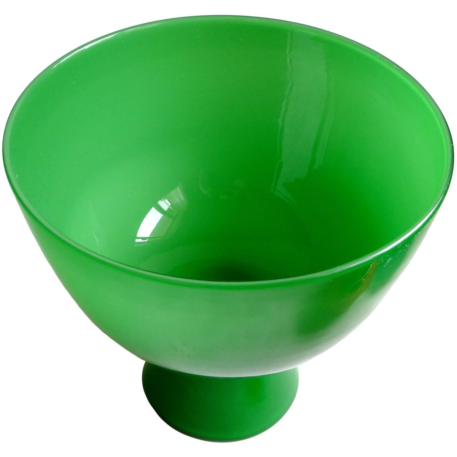 Beautiful and large Murano hand blown emerald green Italian art glass footed compote bowl or vase. Created in the manner of the Venini company. Measures 8