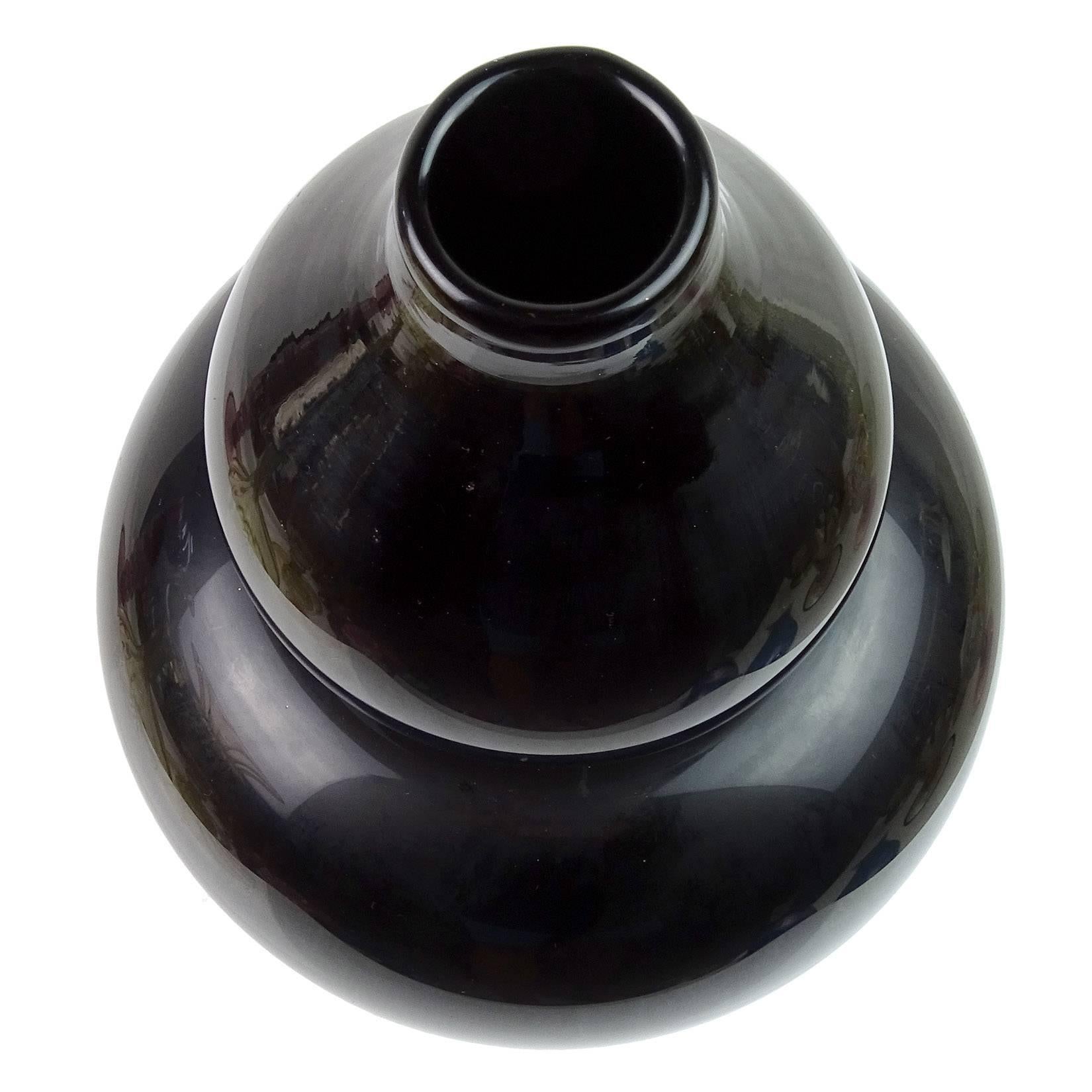Free shipping worldwide! See details below description.

Very rare Murano handblown jet black, gourd shaped Italian art glass flower vase. Documented to designer Carlo Scarpa, and fully signed 