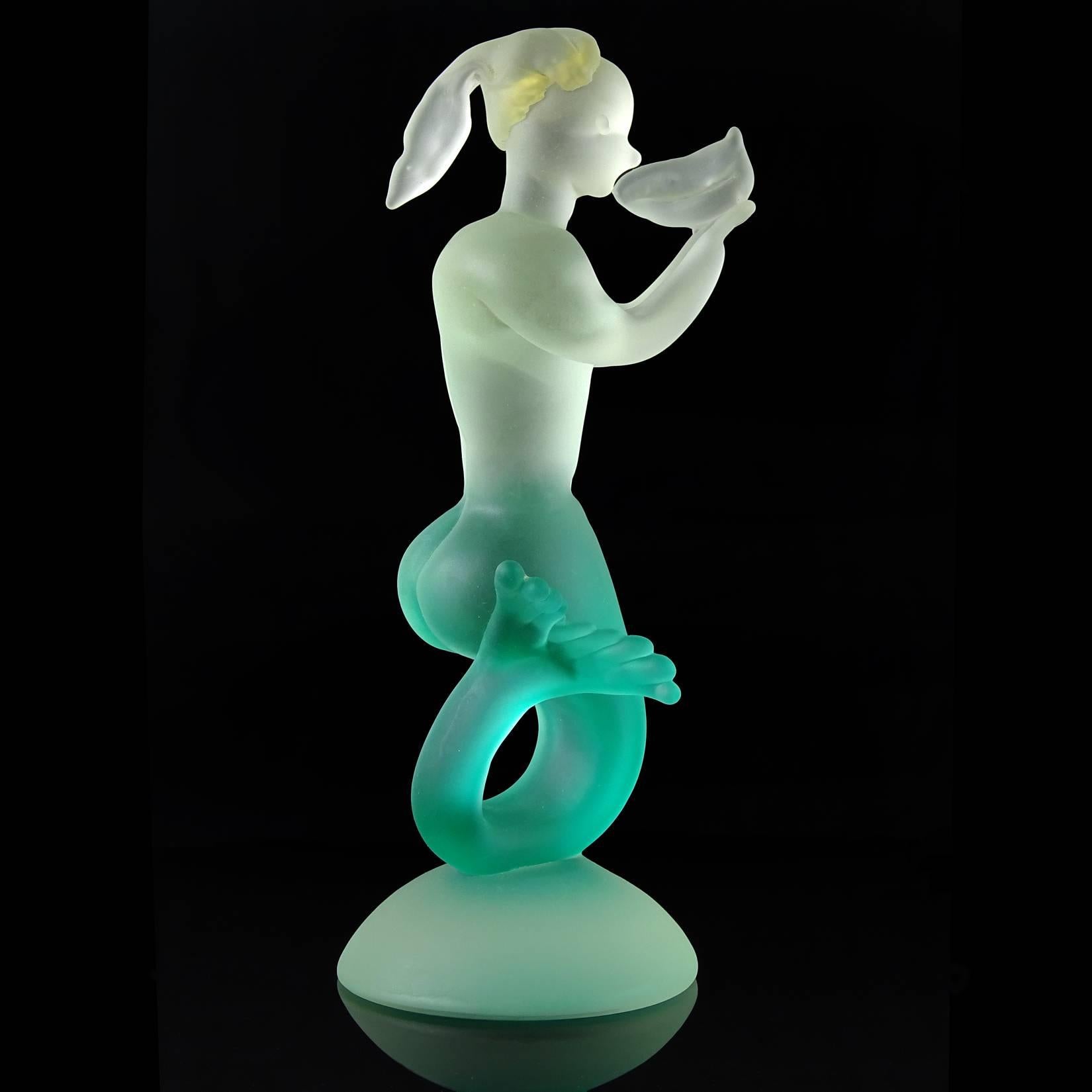 Rare Murano hand blown sommerso green to clear Italian art glass mermaid sculpture. Attributed to the Seguso Vetri d'Arte company. The piece has gold flecks inside her hair and an unusual mark on her chest, that looks like the number 1401 (see last