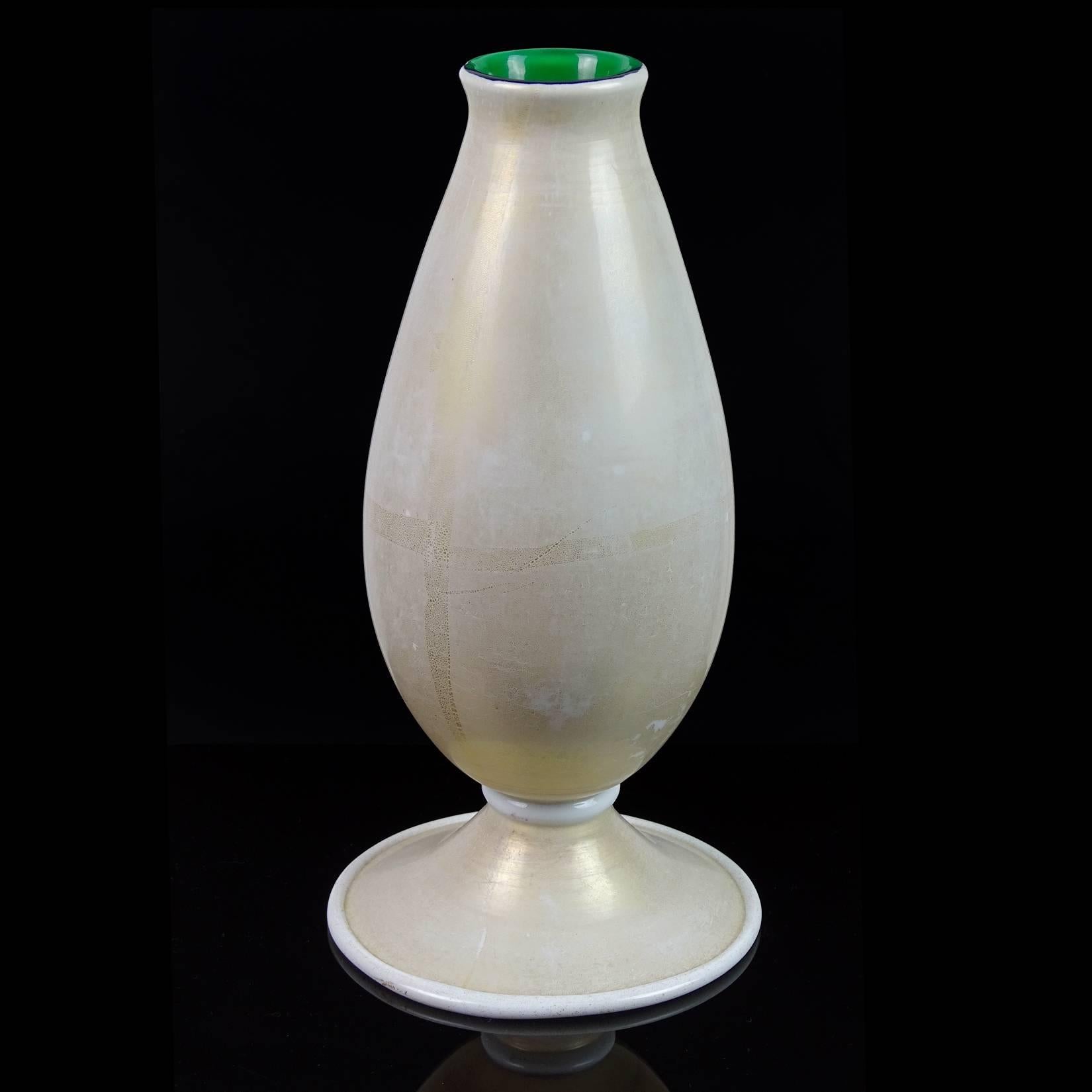 Free shipping worldwide! See details below description.

Gorgeous large Murano handblown white, with heavy gold flecks, white pasta trim and green art glass vase. In the manner of the Venini company. Profusely covered in gold leaf. Original label