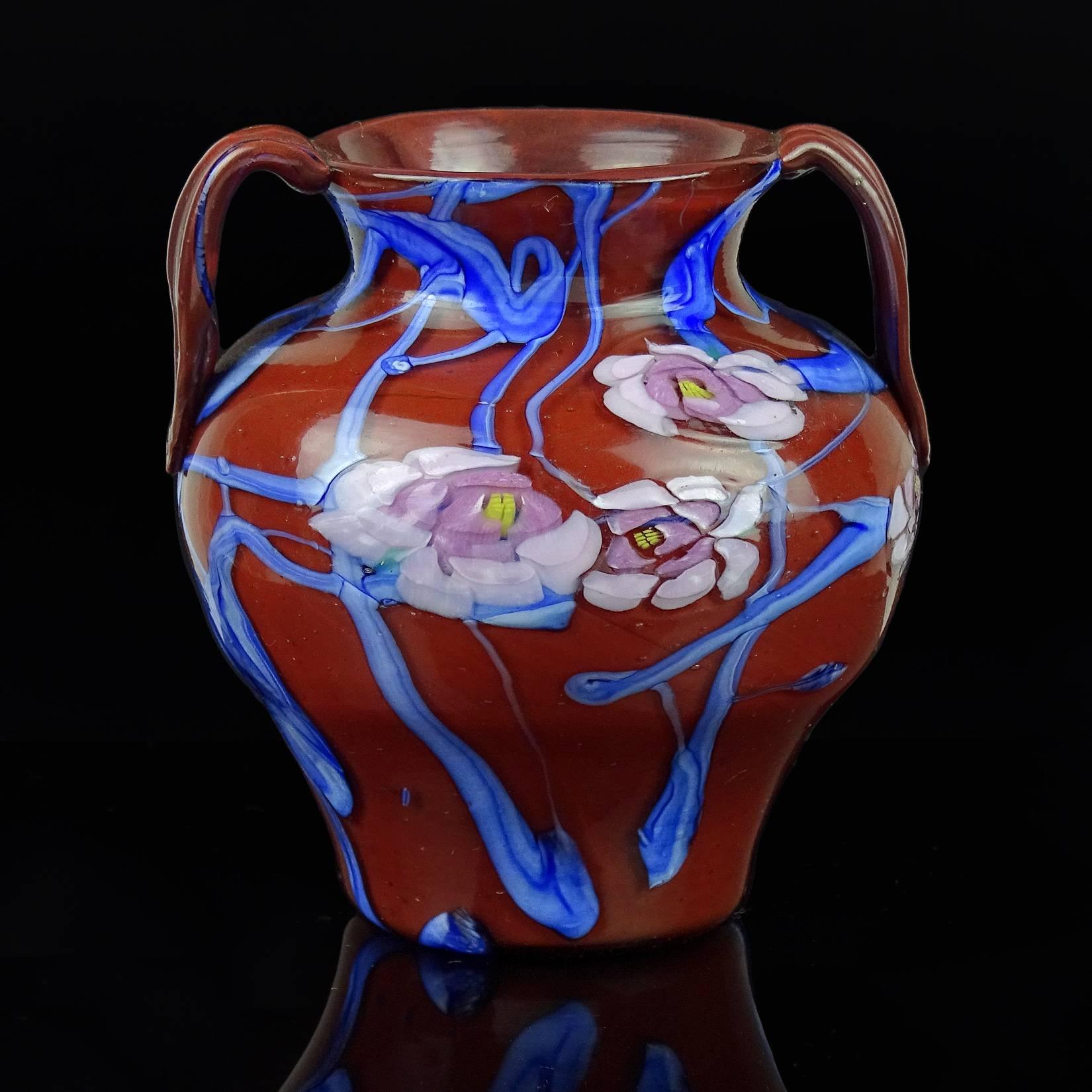 Rare Murano hand blown red, with blue tralis and pink rose murrines Italian art glass cabinet vase. Attributed to Vetreria Artisti Barovier, in the A Murrine Floreali design, circa 1920s. Measures almost 4" tall.