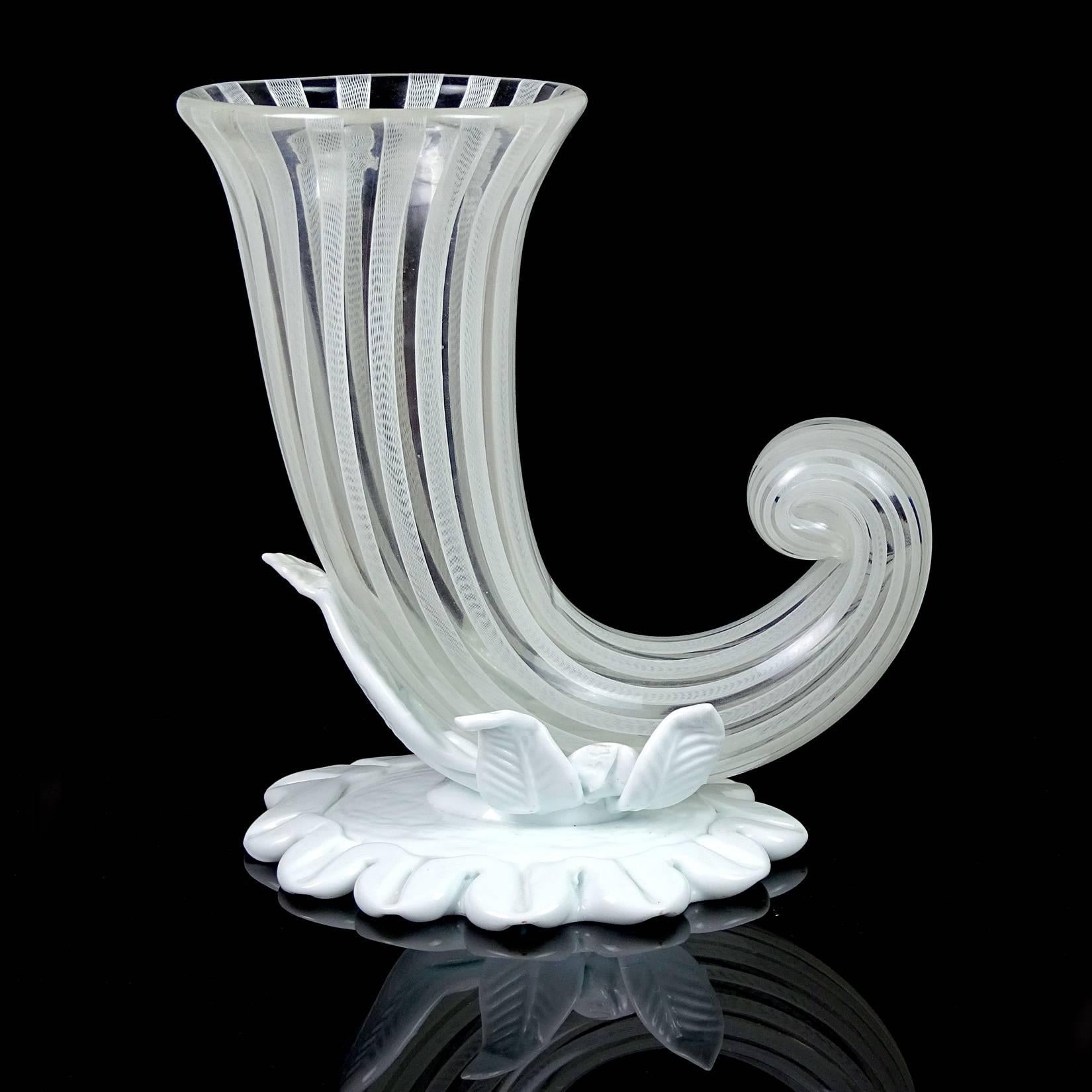 Beautiful and rare, vintage Murano hand blown white with ribbons Italian art glass cornucopia flower vase. Documented design to Fulvio Bianconi for the Venini company, circa 1948, but the signature indicates a later production of 1960s. The vase is
