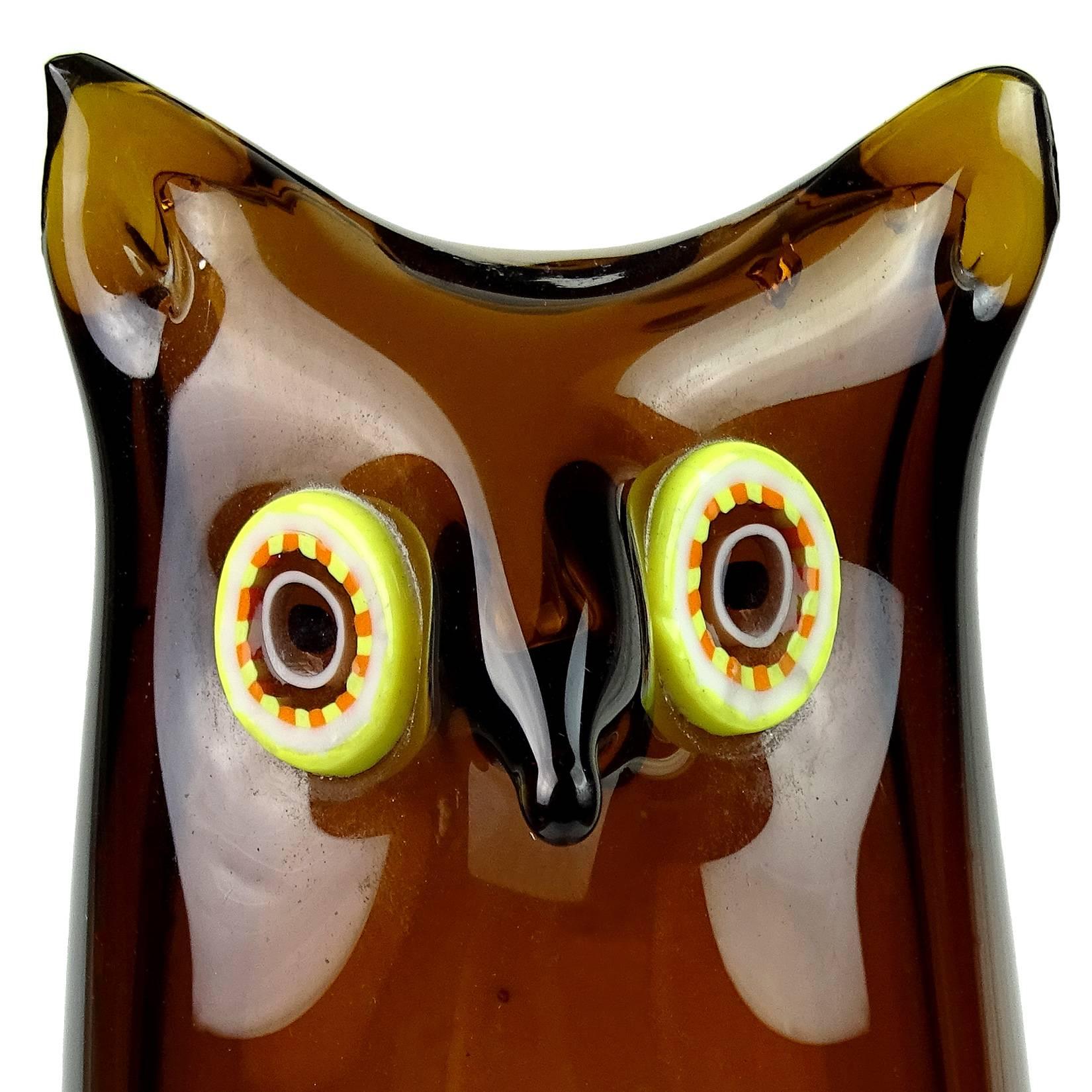 Very rare and cute Murano hand blown dark brown with yellow or orange murrine eyes Italian art glass fox sculpture. Attributed to the Venini company, with original label underneath. Measures 7 1/4" tall.
