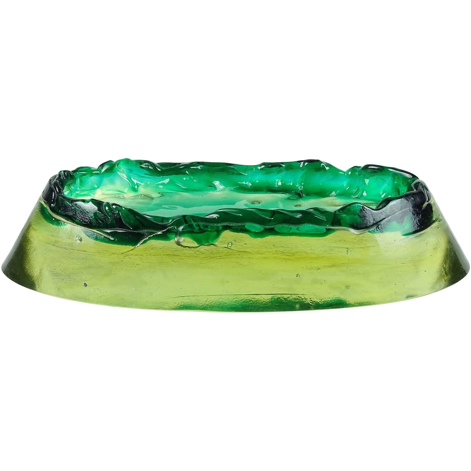 Free shipping worldwide! See details below description.

Murano green and yellow Sommerso volcano island with mountain range rim art glass sculptural bowl / catch all. Documented to the Salviati company. Very unusual piece. Measures 10 1/4” long.