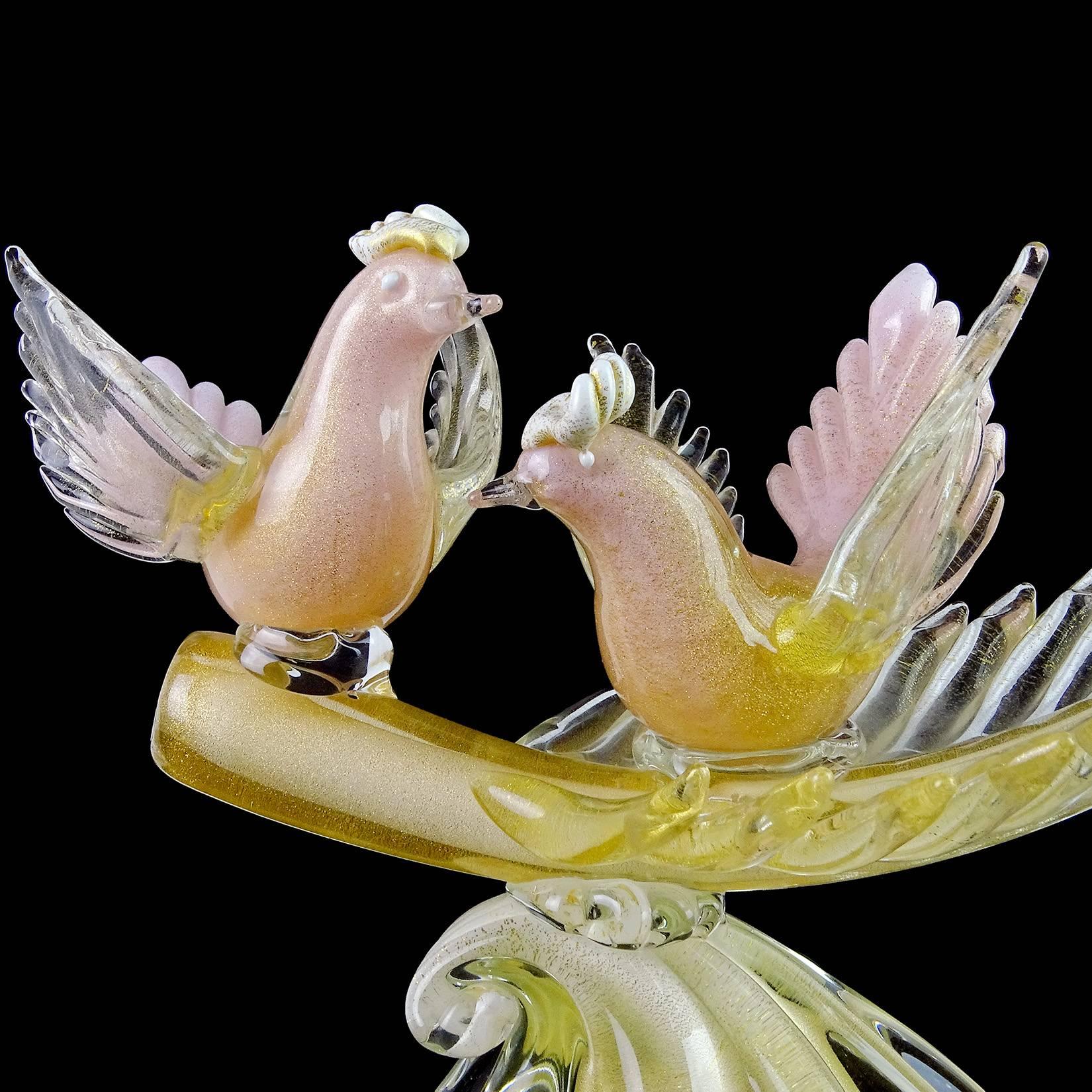 Gorgeous large Murano hand blown pink, white and gold flecks Italian art glass courting birds on leaf sculpture. Documented to designer Alfredo Barbini. The birds are beautifully sculpted and profusely filled with gold leaf throughout. They sit on a