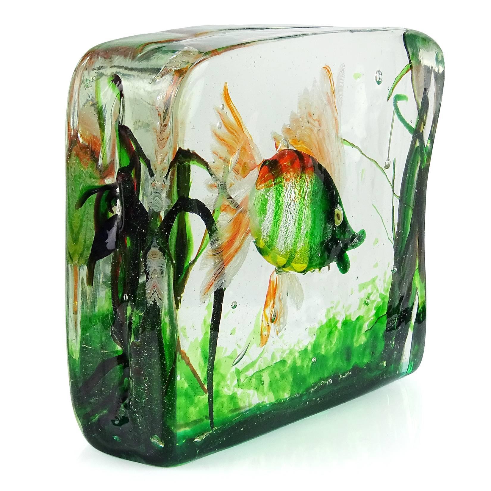 Beautiful Murano hand blown orange, green stripes, and silver flecks Italian art glass fish aquarium sculpture. Documented to the Cenedese company, and attributed to designer Alfredo Barbini. The fish has wispy ribbon fins in white and orange,