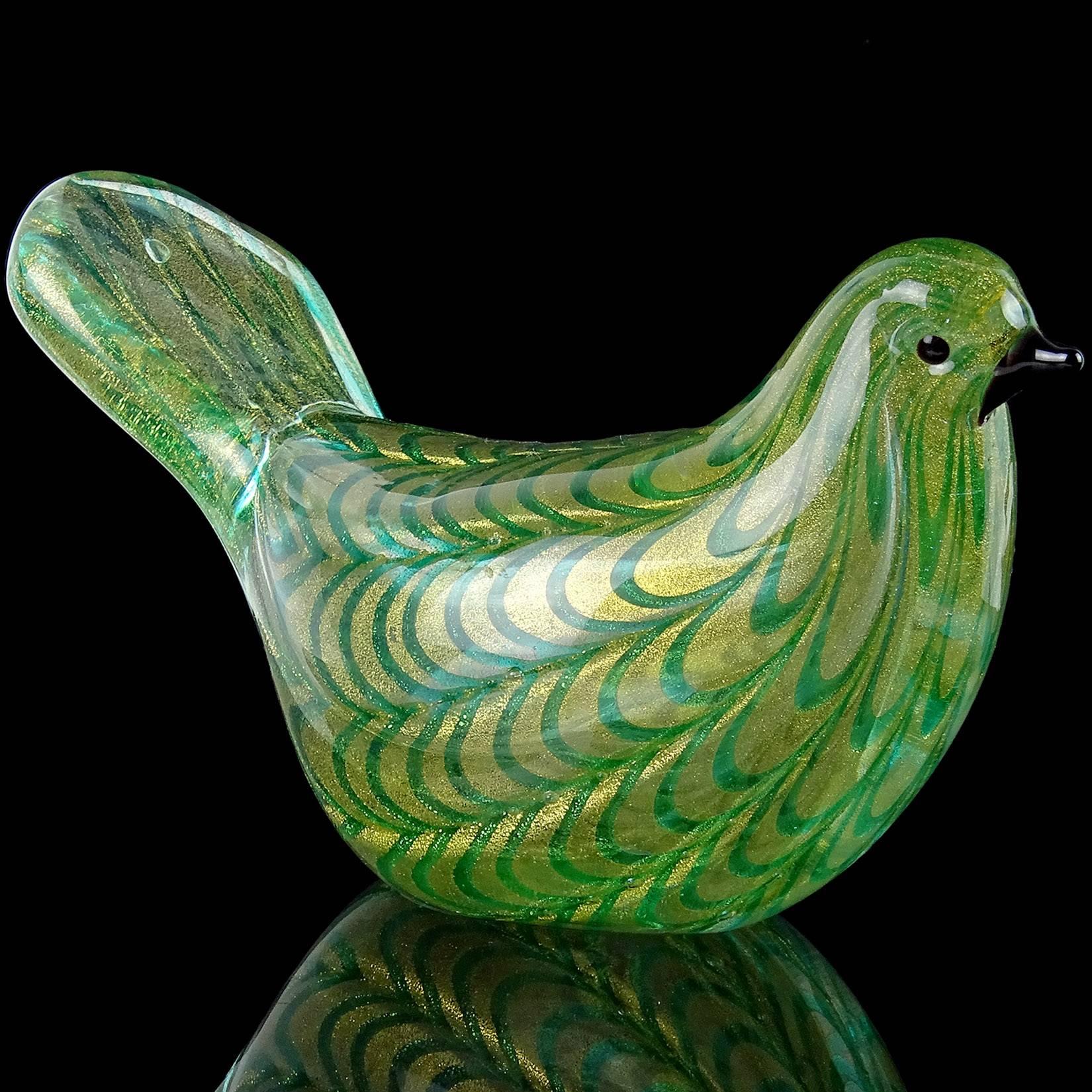 Beautiful Murano handblown green spiderweb/pulled feather design with gold flecks Italian art glass bird figurine/paperweight. Documented to the Barovier e Toso company. Measures 6 3/4” long x 3 3/4” tall x 3” wide.