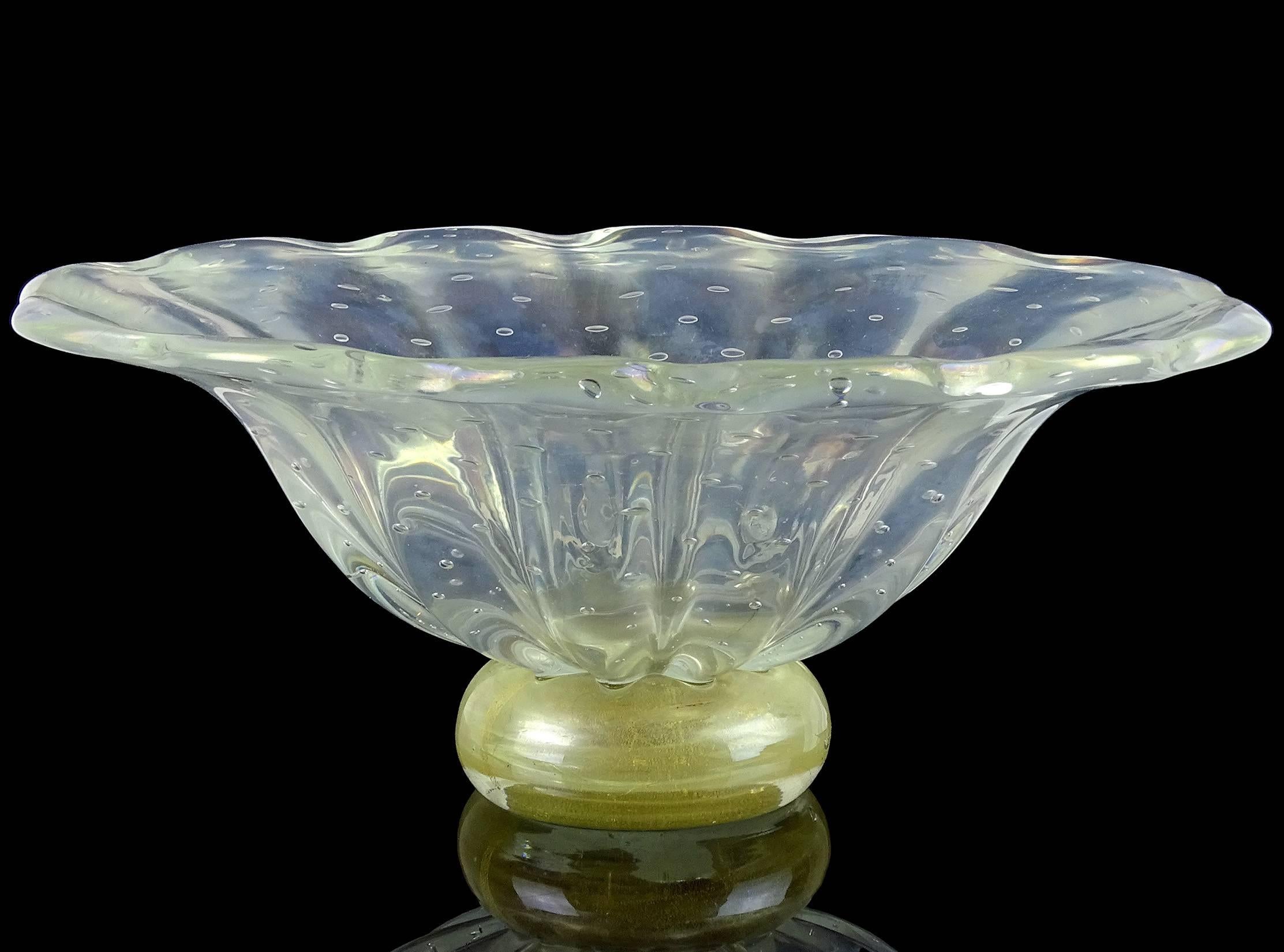 Beautiful large Murano handblown iridescent, controlled bubbles and gold flecks Italian art glass centrepiece bowl. Attributed to the Barovier e Toso company. The piece stands on a gold leaf base, and has heavy iridescence throughout. Measures 12