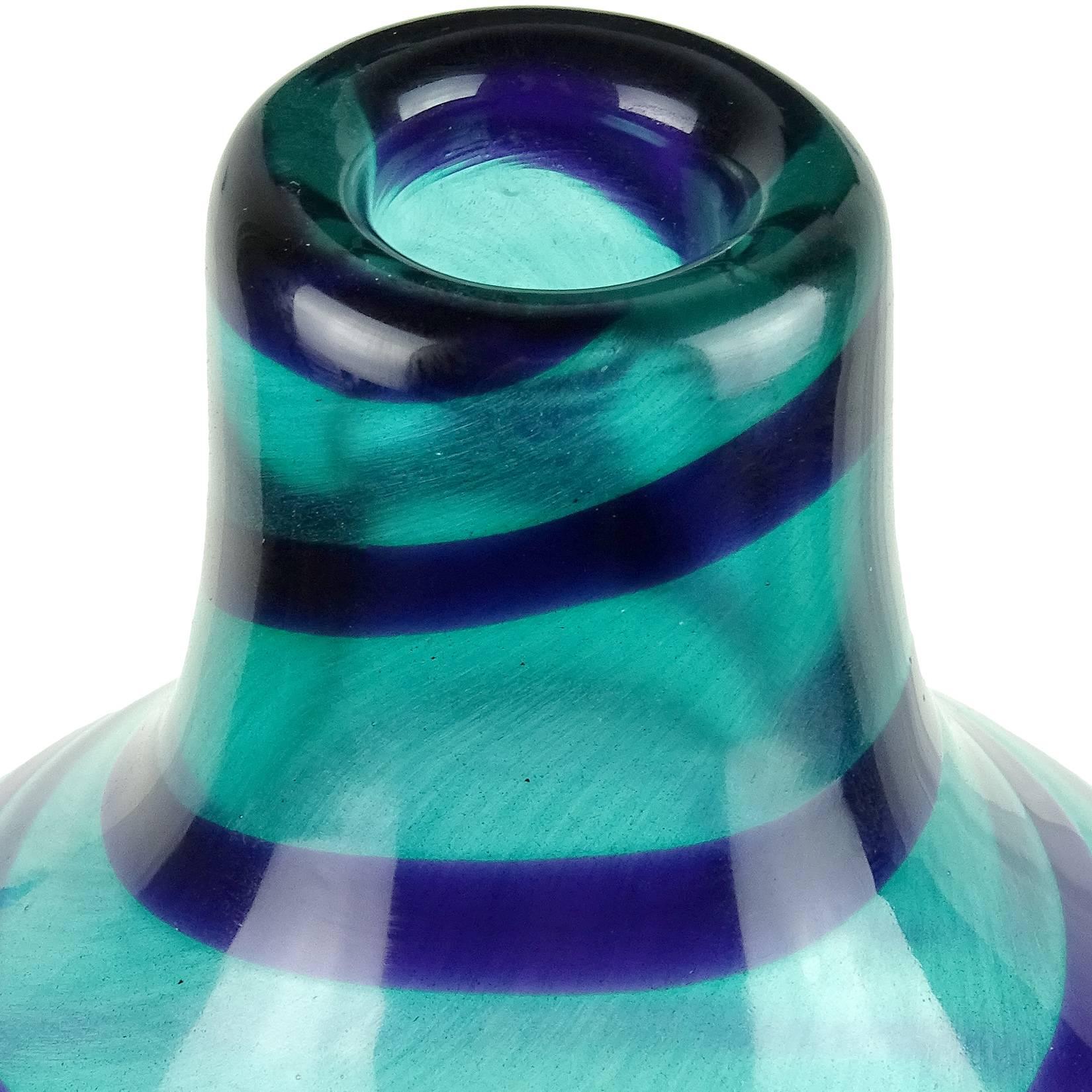 Beautiful Murano handblown aqua blue Italian art glass gurgle vase or bottle. Created in the manner of Venini, with slight surface textured and smooth cobalt blue swirling stripe. Measures 14