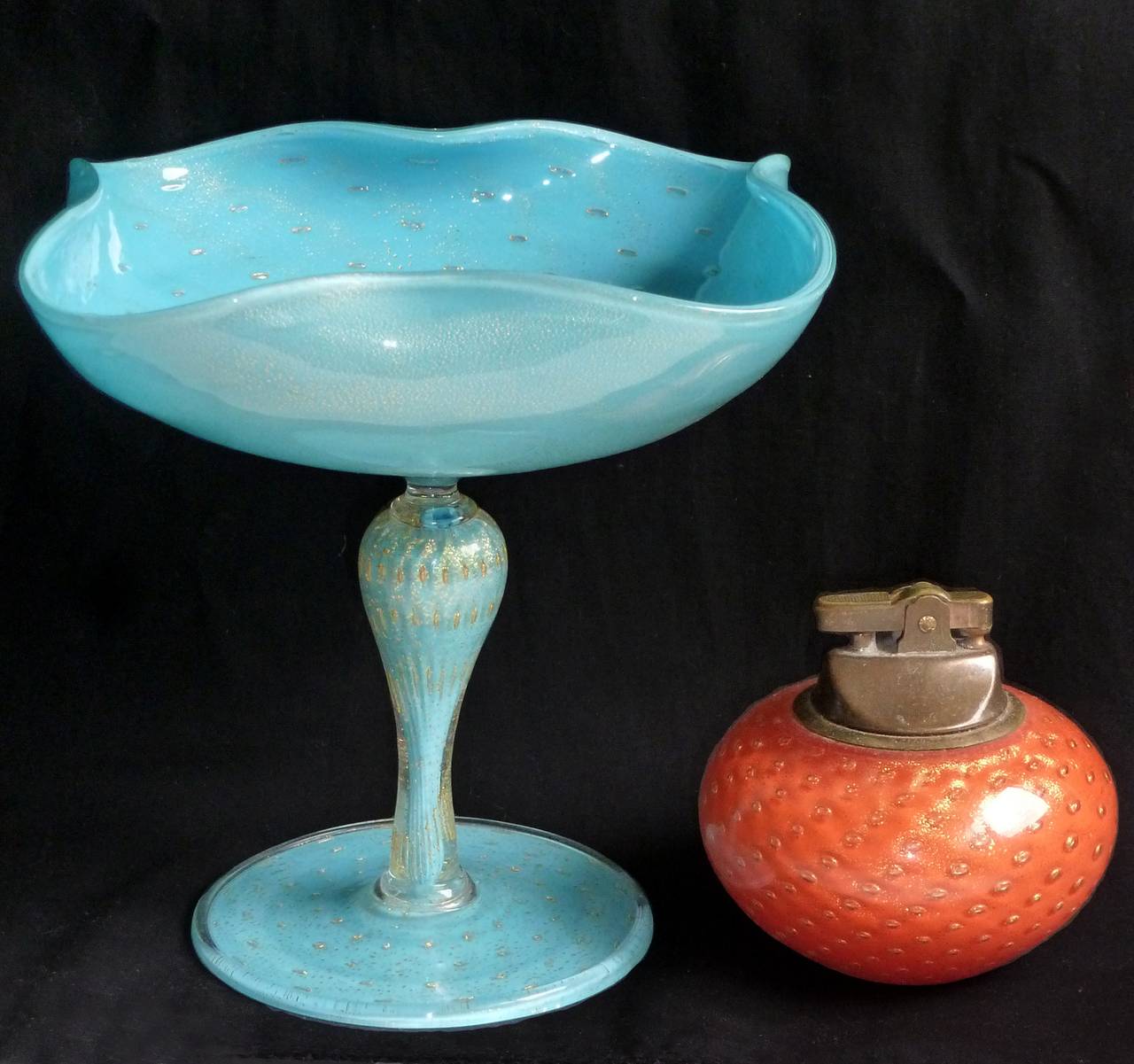 Gorgeous Murano handblown sky blue, controlled bubbles and gold flecks Italian art glass pedestal compote bowl. Documented to designer Alfredo Barbini, circa 1950s. Profusely covered in gold leaf inside and out and with a squared top. This is one of