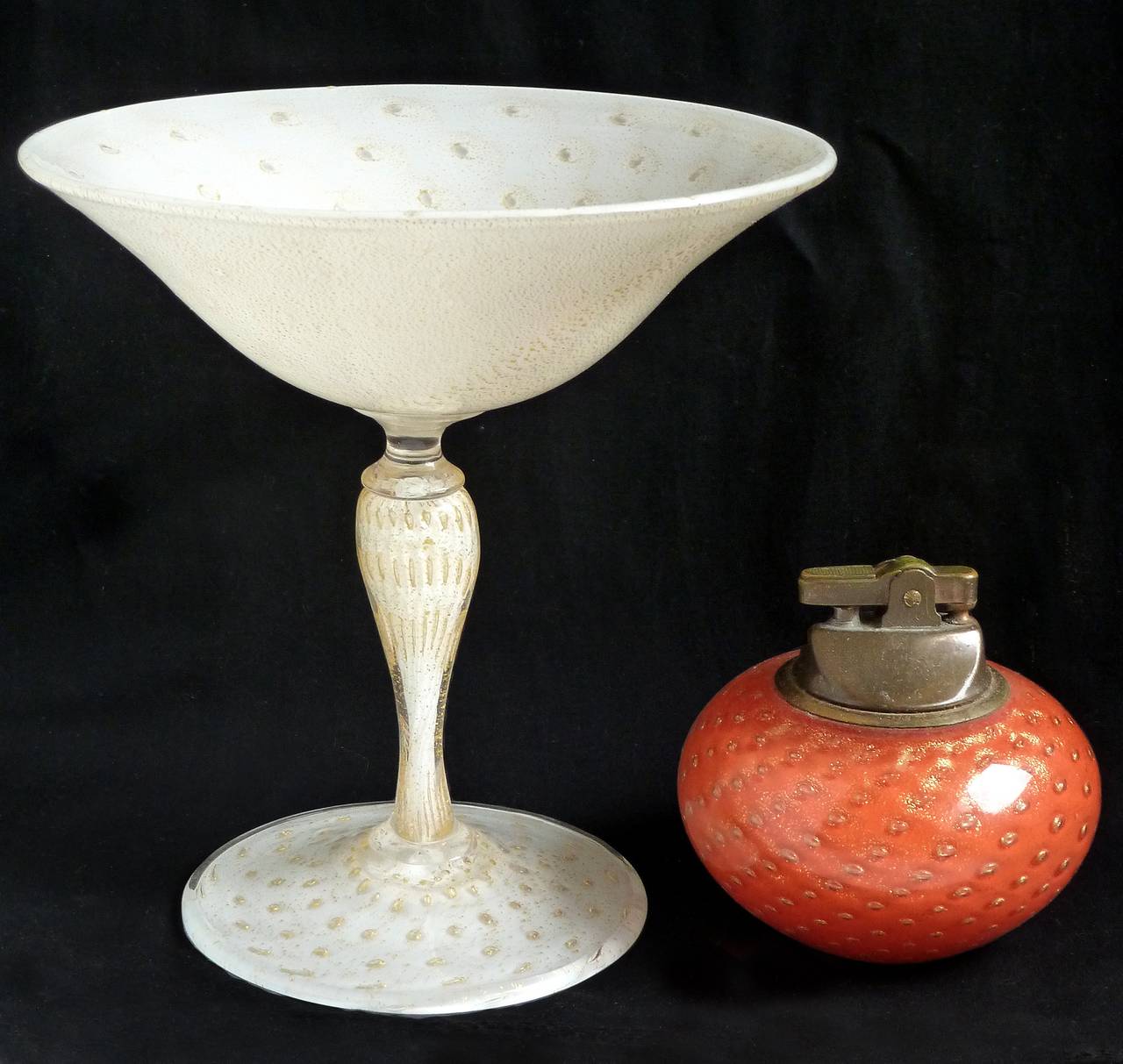 Gorgeous Murano handblown white, controlled bubbles and gold flecks Italian art glass pedestal compote bowl. Documented to designer Alfredo Barbini, circa 1950s. Profusely covered in gold leaf inside and out, and with a martini glass shape. This is