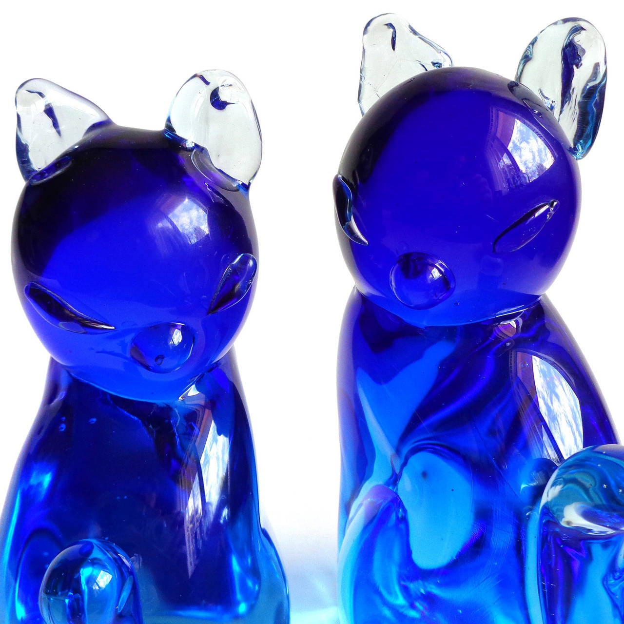 Beautiful Murano cobalt blue Sommerso Italian art glass figural kitty cat bookends. Documented to designer Archimede Seguso, with original labels still attached. Gorgeous color and super cute. Tallest is 6 1/4