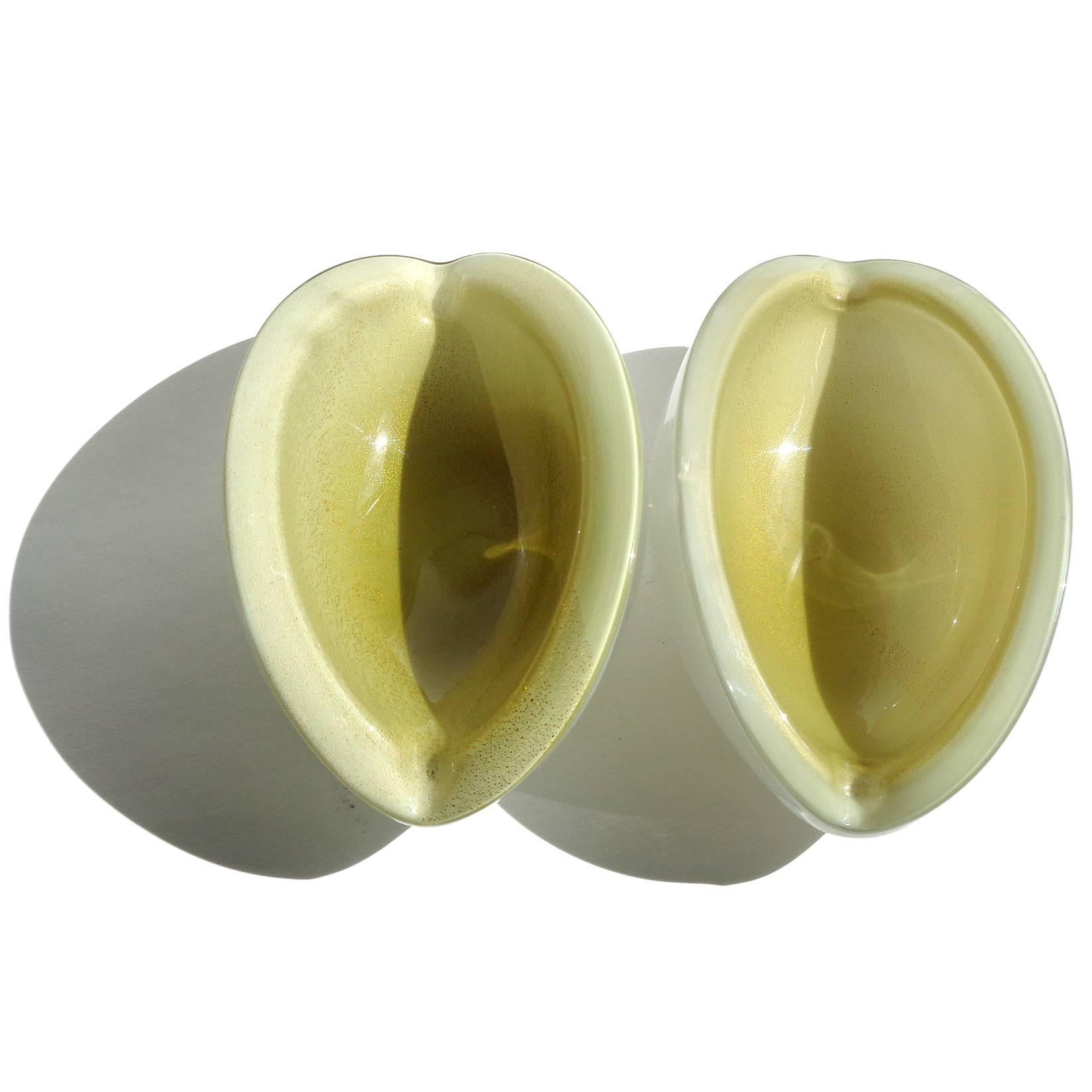 Priced per item - Beautiful Murano handblown white, olive green and gold leaf Italian art glass melon cut bowls. Documented to designer Alfredo Barbini. Cut at an angle on both sides, with small indents at each end. Great decorative piece for any