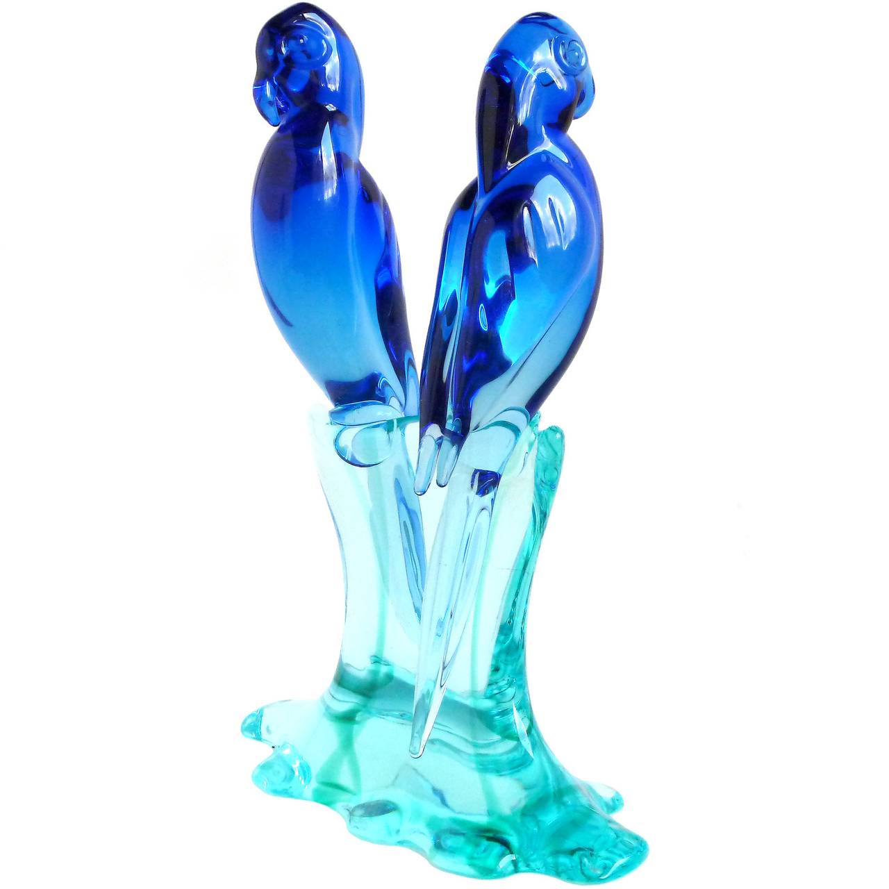 Beautiful Murano handblown cobalt blue Sommerso Italian art glass parrots on aqua base. Documented to designer Archimede Seguso. A must for the bird collector. Measures 9 3/4