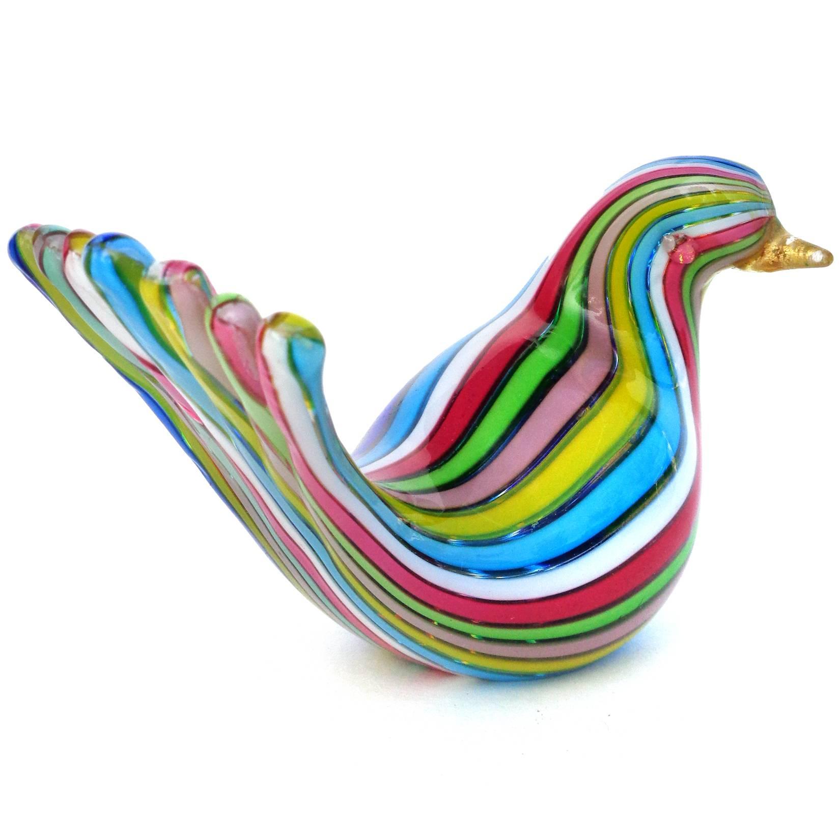 Gorgeous pair of Murano hand blown rainbow Filigrana ribbons and gold flecks art glass duck and bird figures. Documented to the Fratelli Toso company. The duck still retains a Murano label. Duck measures 5 3/4