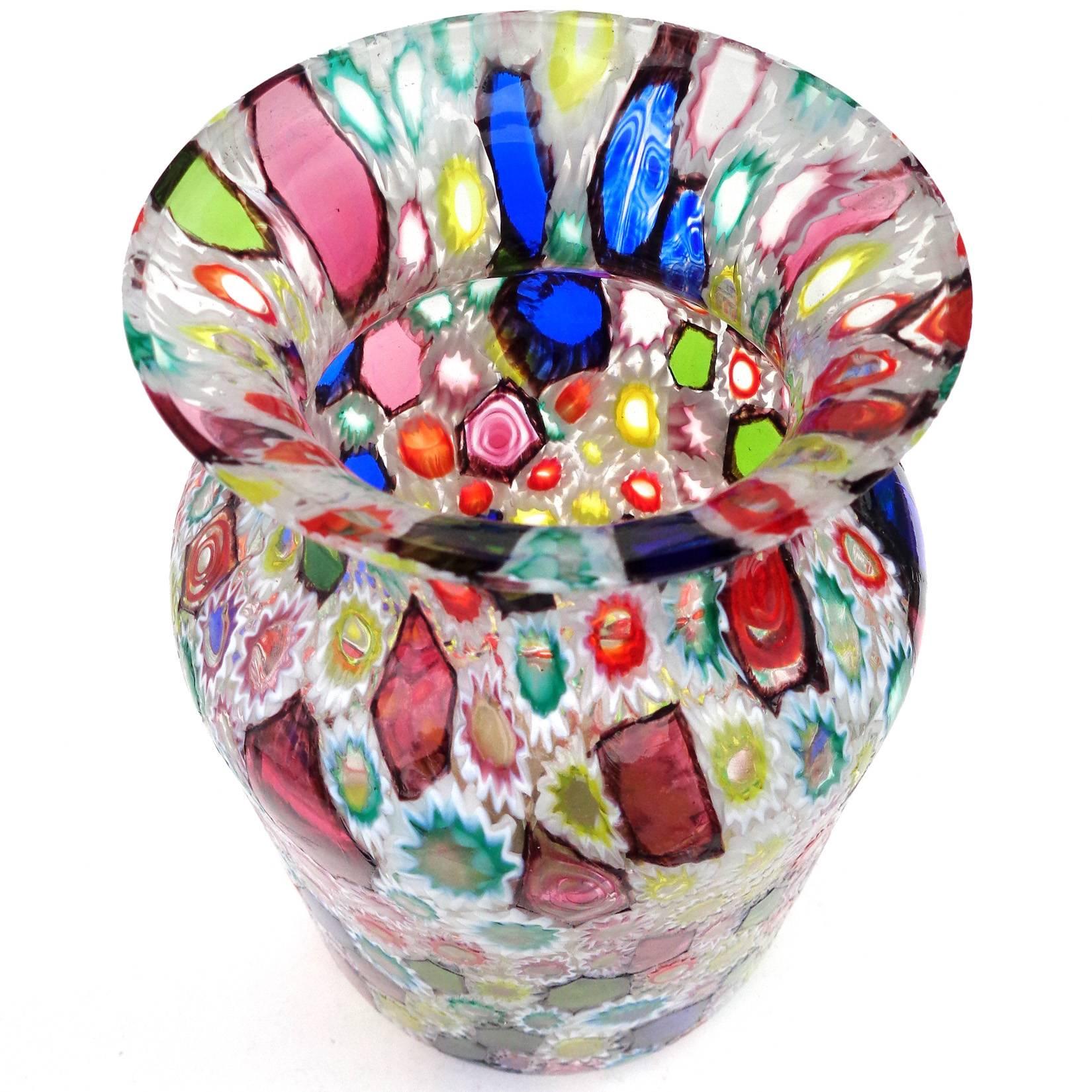Gorgeous Murano handblown multi-color Millefiori flower and star mosaic Italian art glass flower vase. Documented to the Fratelli Toso company. Many of the murrines are lined in white, but some are lined in metallic black. Measures 7 1/4