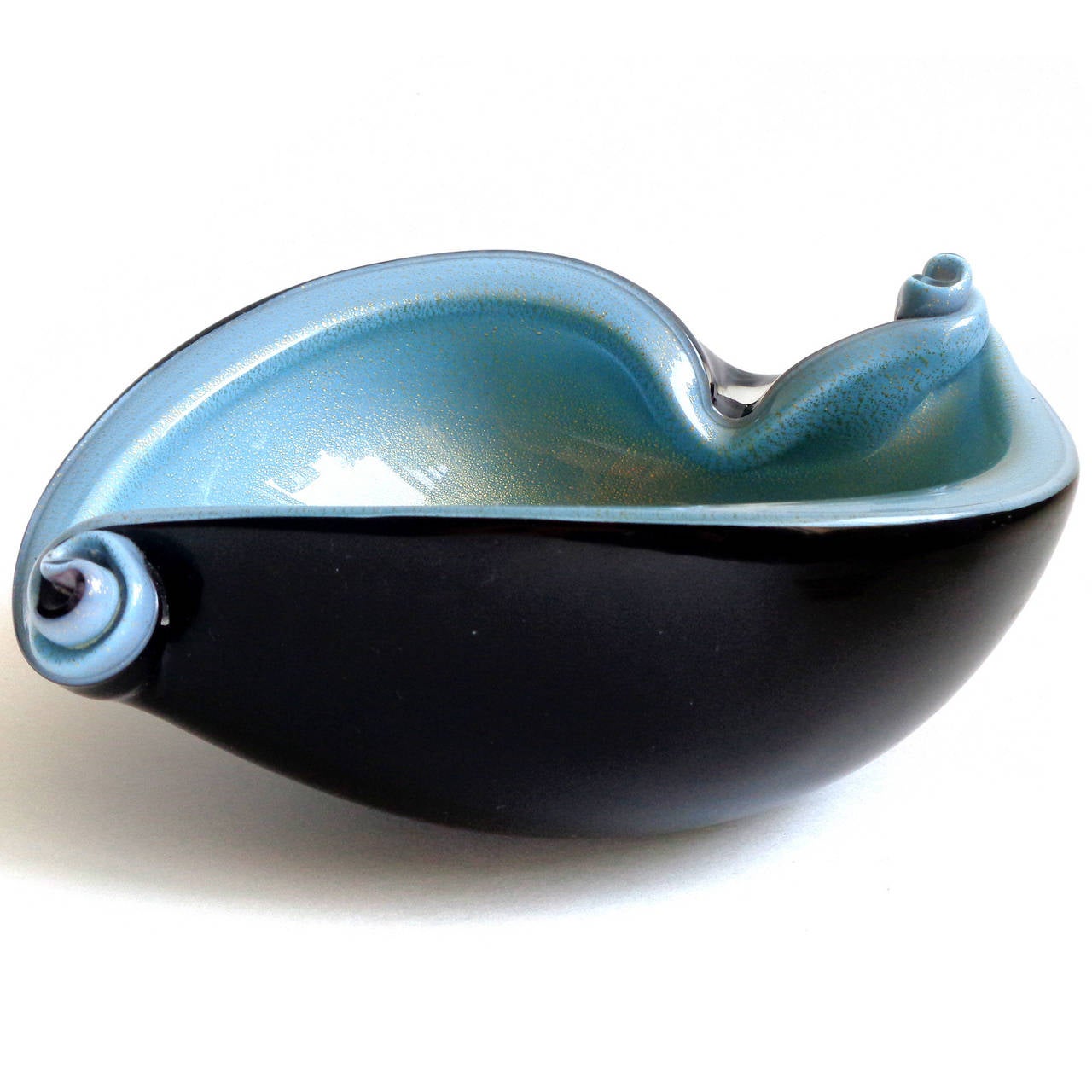 Beautiful Murano handblown black, blue and gold flecks Italian art glass bowl, with scroll decoration. Documented to designer Alfredo Barbini, circa 1950s and published in his catalog. Great color combination and shell shape. There are 2 similar