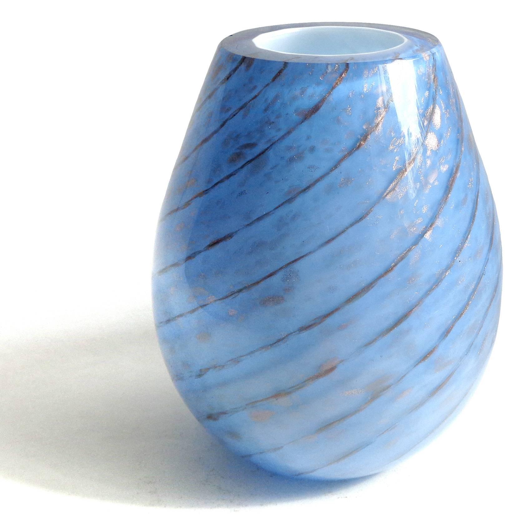 Beautiful Murano handblown blue over white and copper aventurine Italian art glass flower vase. Documented to the Fratelli Toso company. The piece has a candy cane swirl and glitters in the light. More vases in this design in my gallery. Also