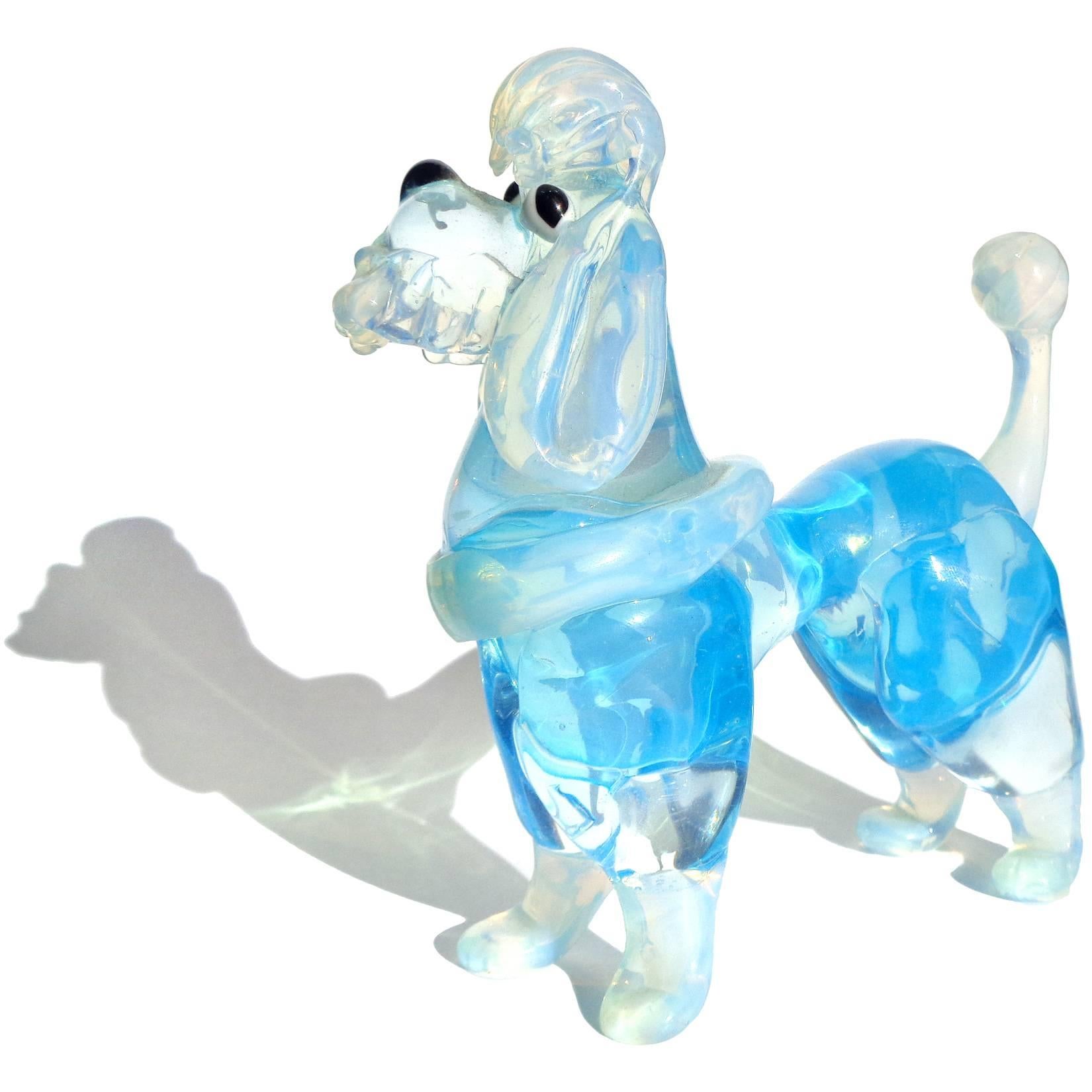Priced per item - Very cute Murano handblown pink and blue Italian art glass opalescent poodle dog figurines. Attributed to the Barovier e Toso company, circa 1960s. The pink dog is a little larger than the blue one. Both pups are very well