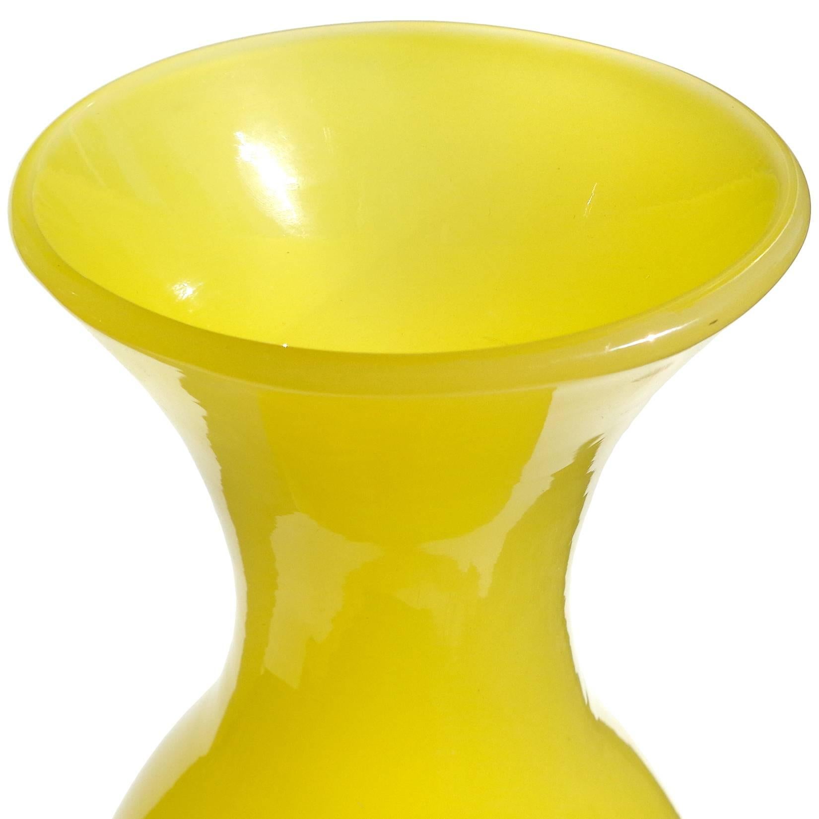 Large Murano handblown canary yellow opalescent Italian art glass flower vase. Documented to designer Archimede Seguso, with original intact label underneath. Created in the 