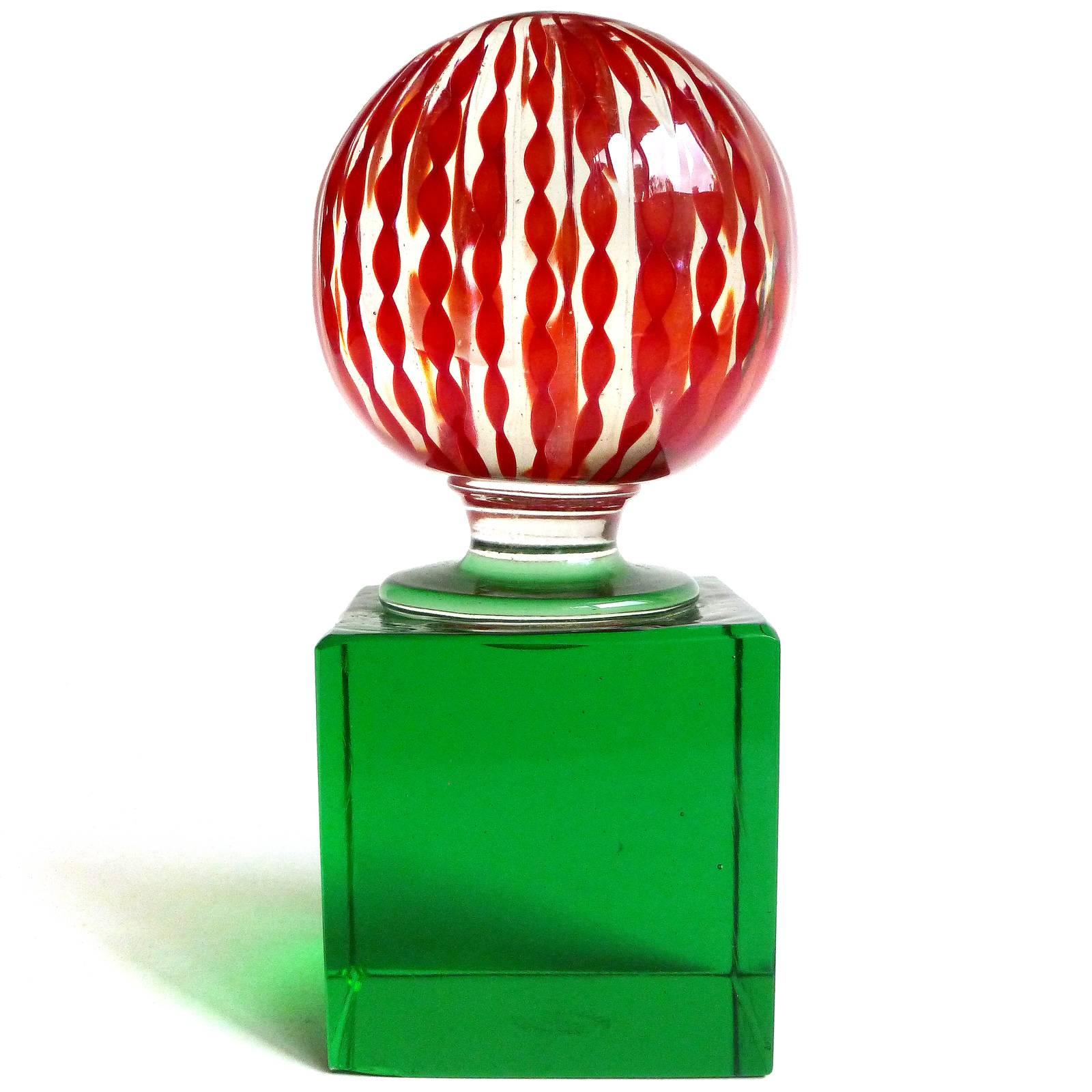 Murano handblown red twisted ribbons on green base Italian art glass paperweight. Documented to Paolo Venini, and signed underneath 