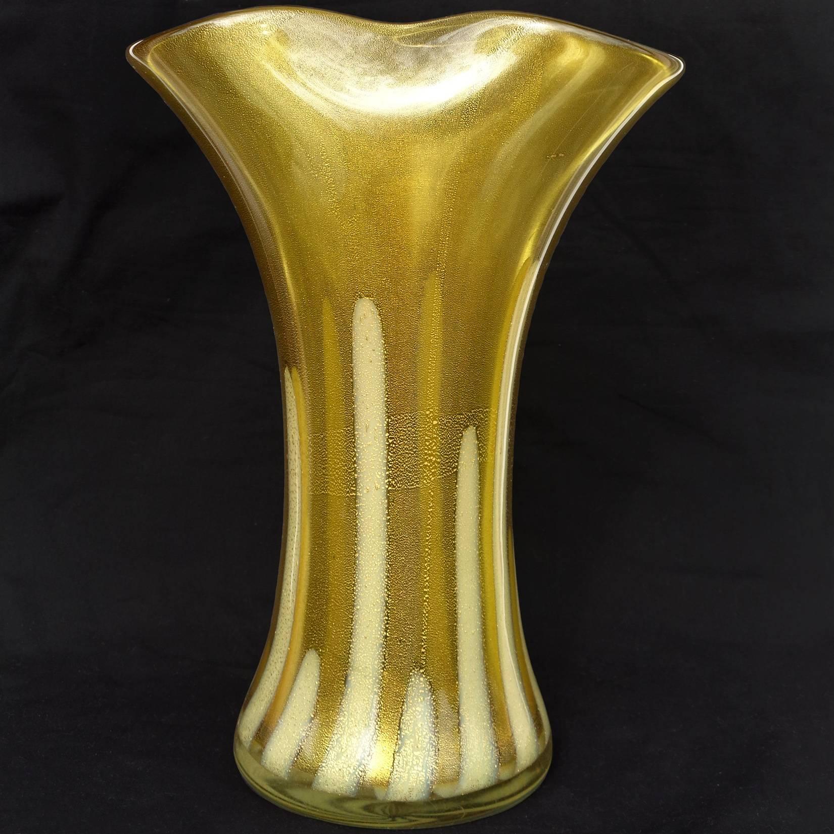 Beautiful large Murano hand blown olive green, white stripes and gold flecks art glass flower vase. Attributed to designer Alfredo Barbini. The piece has a pinched rim, and profusely covered in gold leaf. Measures: 12