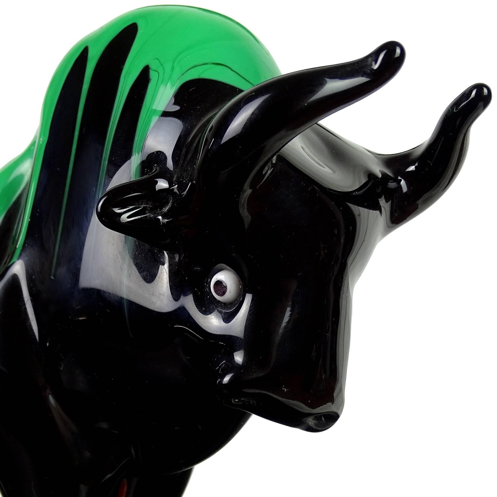 Beautiful large Murano hand blown, jet black with green drips Italian art glass Taurus bull sculpture. Has a red Murano label on the base. Measures 10