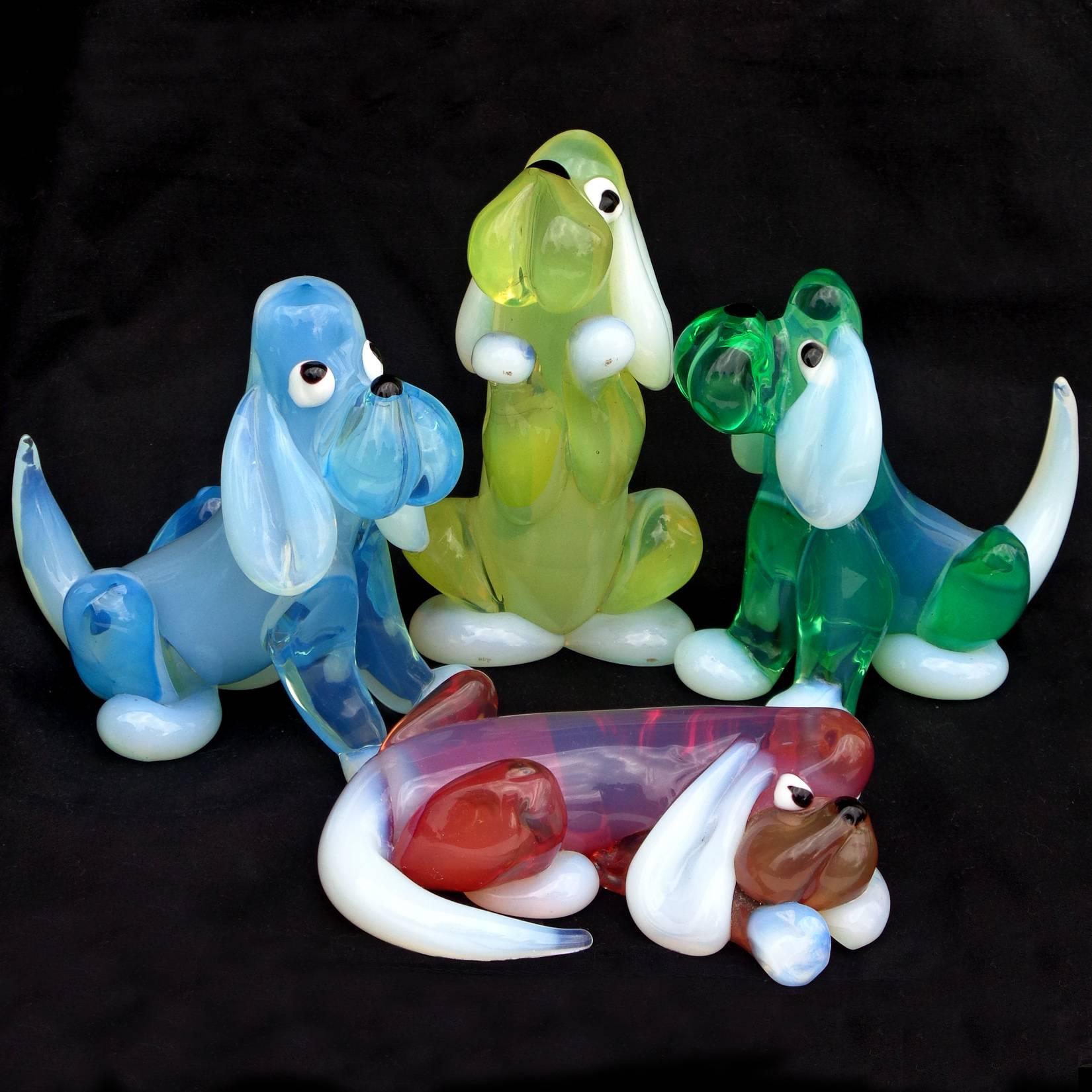 Very rare and cute set of Murano handblown opal pink, yellow, blue and green art glass puppy dog figures. Documented to the Barovier e Toso company, circa 1970s. Last photo shows three different labels on them. Measurements vary, tallest is 5 1/2