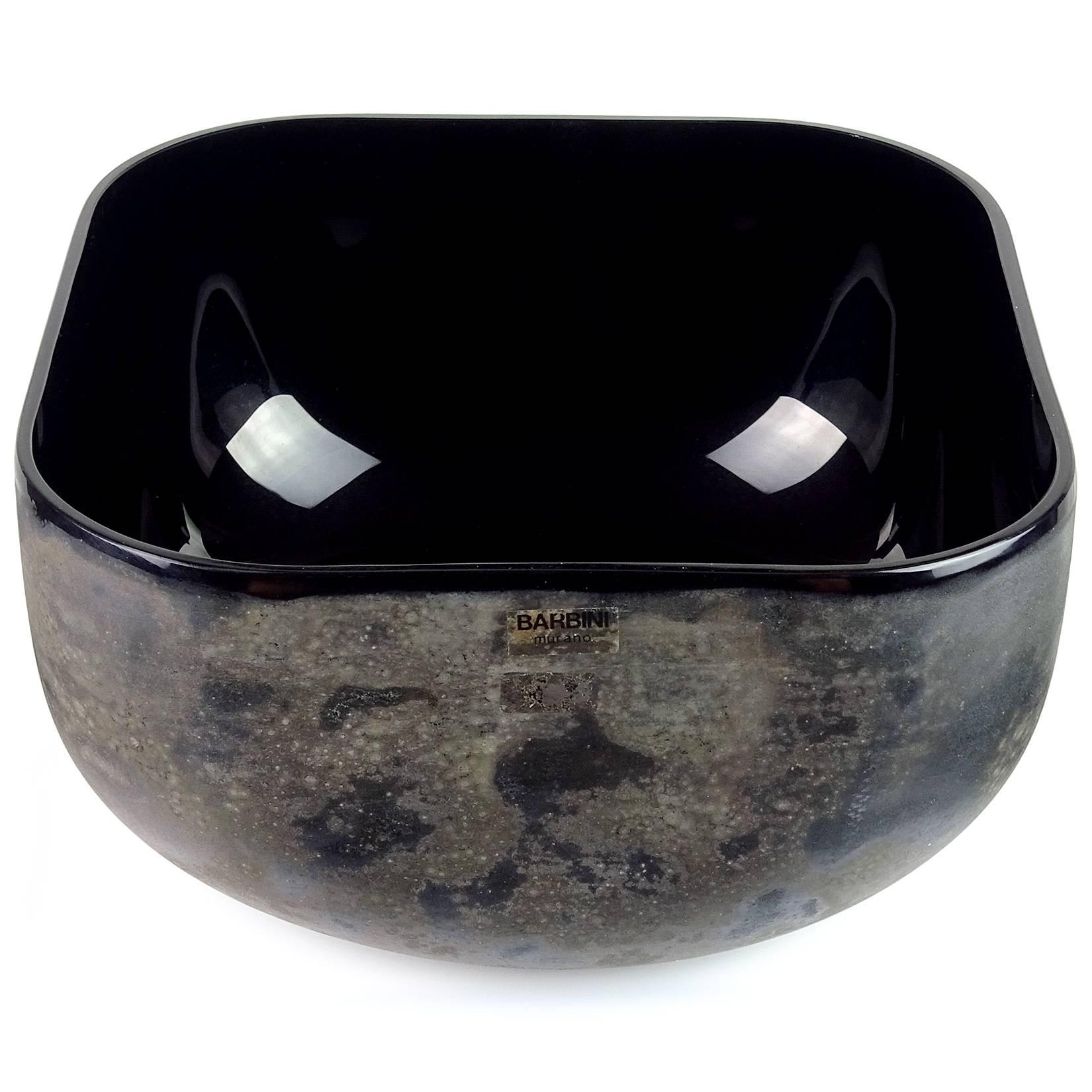 Beautiful large Murano hand blown jet black Italian art glass centerpiece bowl with “Scavo” lava surface texture and slight iridescence. Documented, and fully signed by designer Alfredo Barbini, for Oggetti. It is also numbered. Measures 10 1/4” x