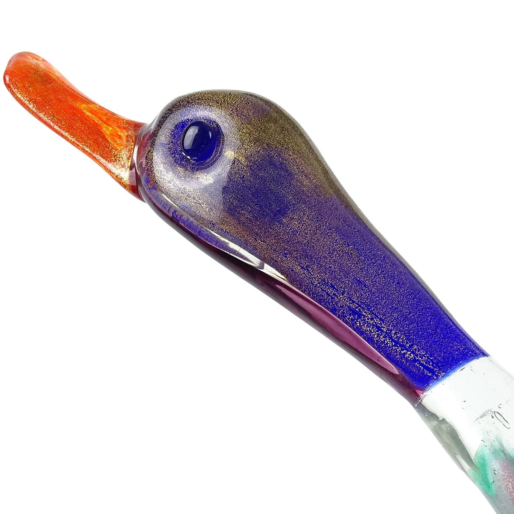 Beautiful, large and rare Murano hand blown Sommerso rainbow colors, controlled bubbles and gold flecks Italian art glass duck / goose shaped centrepiece vase. Attributed to designer Flavio Poli, for Seguso Vetri d’Arte, circa 1940s. The bird is