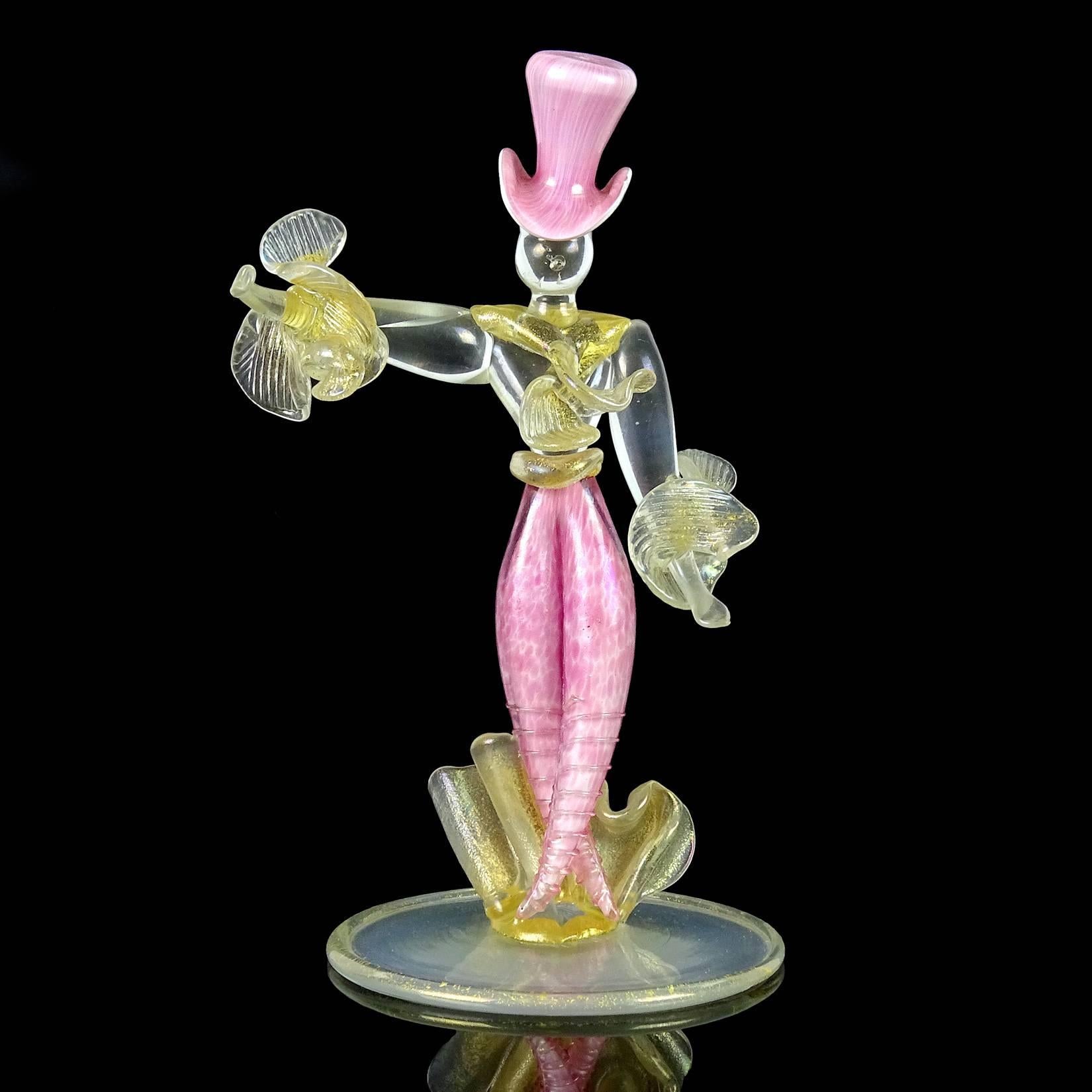 Rare Murano hand blown iridescent pink Italian art glass man in top hat figurine / sculpture. Documented to designer Flavio Poli for Seguso Vetri d'Arte, circa 1930s. It has a gold leaf accents with high iridescence throughout. Measures 7 3/4