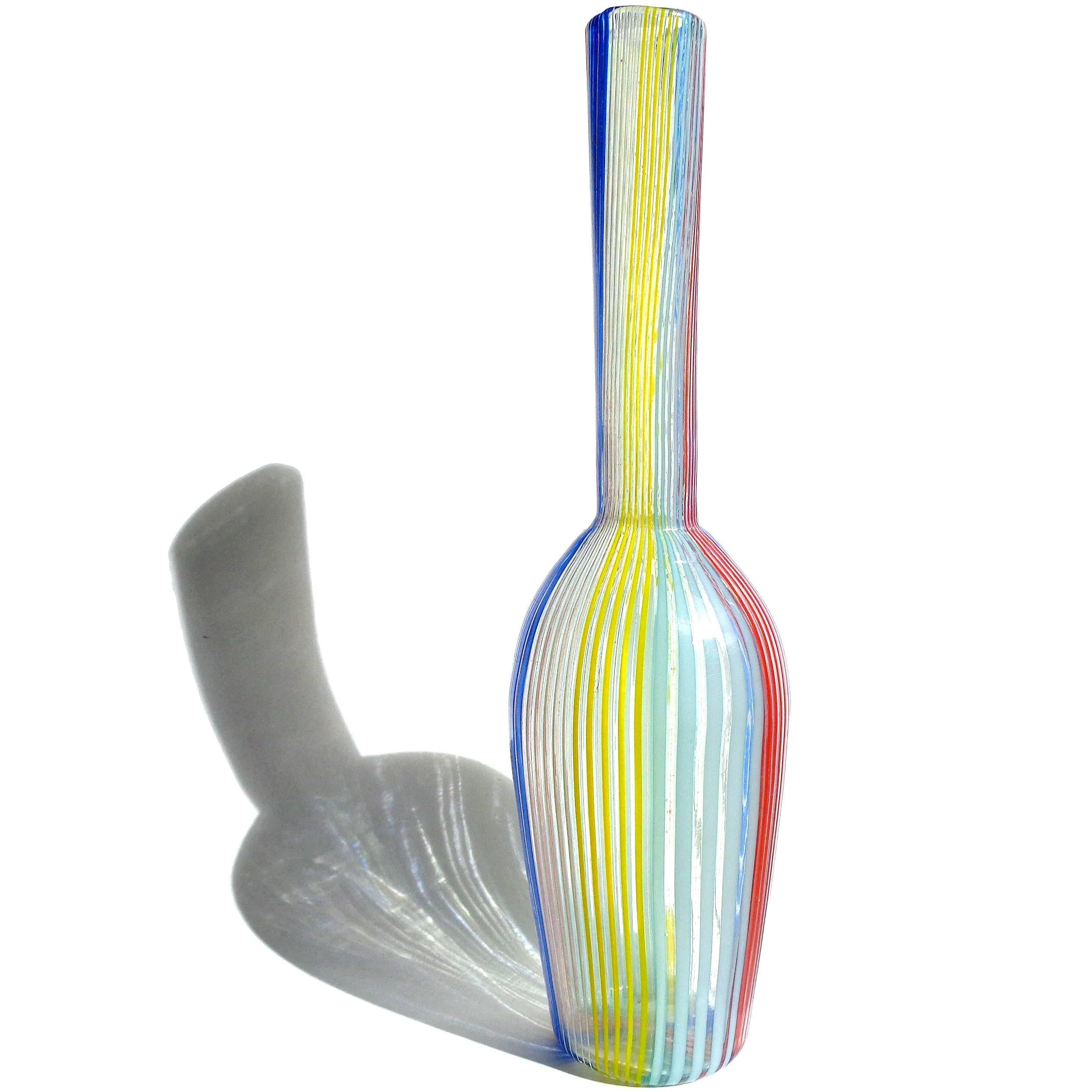 Free shipping worldwide! See details below description.

Rare and beautiful Murano handblown red, yellow, white, light blue and cobalt filigrana ribbons art glass vase. Documented to designer Dino Martens for Aureliano Toso. A similar vase is
