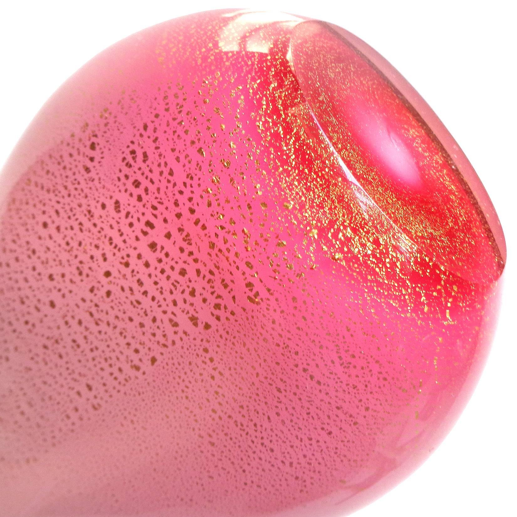 FREE Shipping Worldwide! See details below description.

Beautiful Murano hand blown opal pink and gold flecks art glass flower vase. Documented to designer Archimede Seguso, circa 1961. The piece goes from a pale pink at the top to a more darker