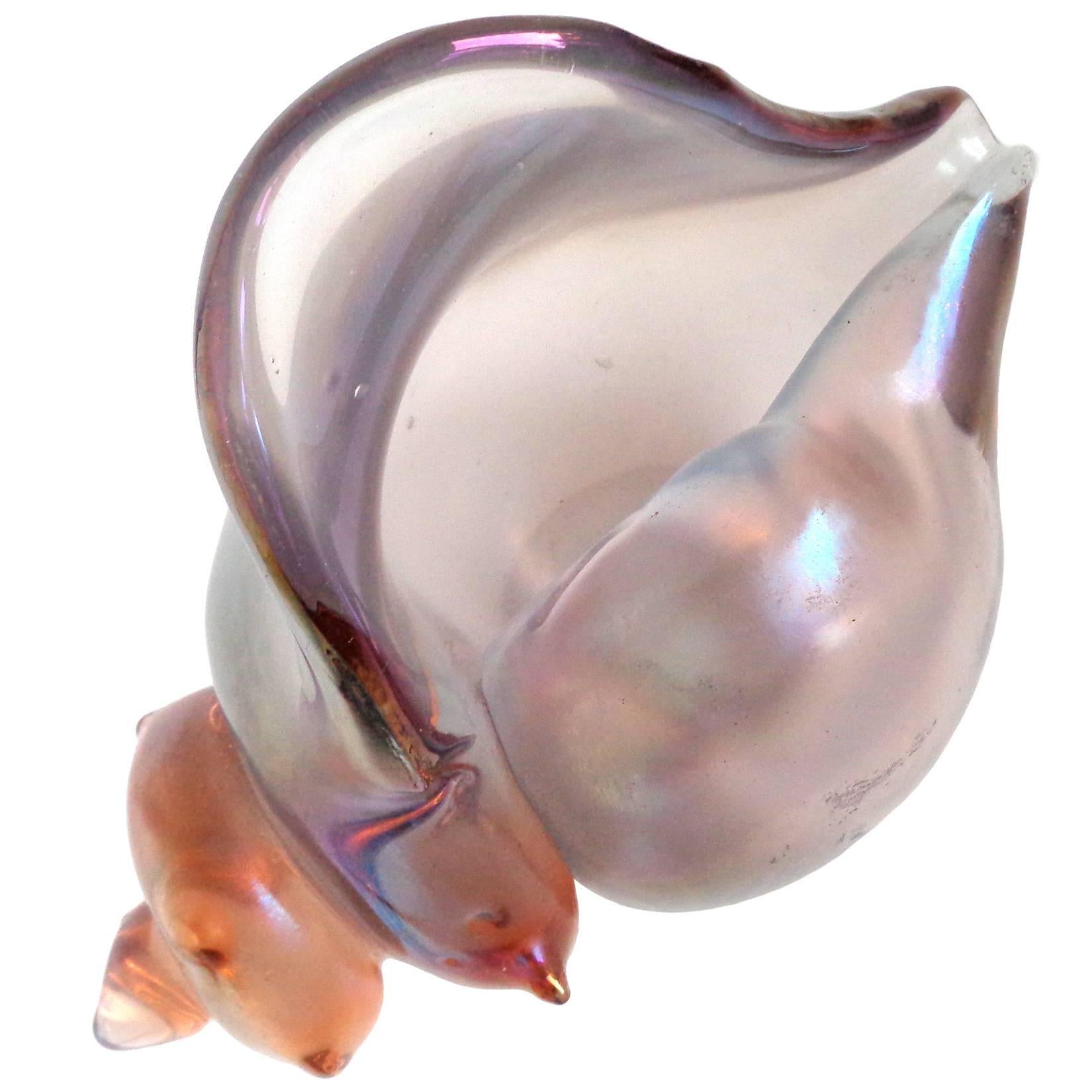 Free shipping worldwide! See details below description.

Very rare Murano handblown peach to silver color iridescent art glass conch shell sculpture. Documented to the Seguso Vetri d'Arte company, model # 17503. A collectors item!

Please look