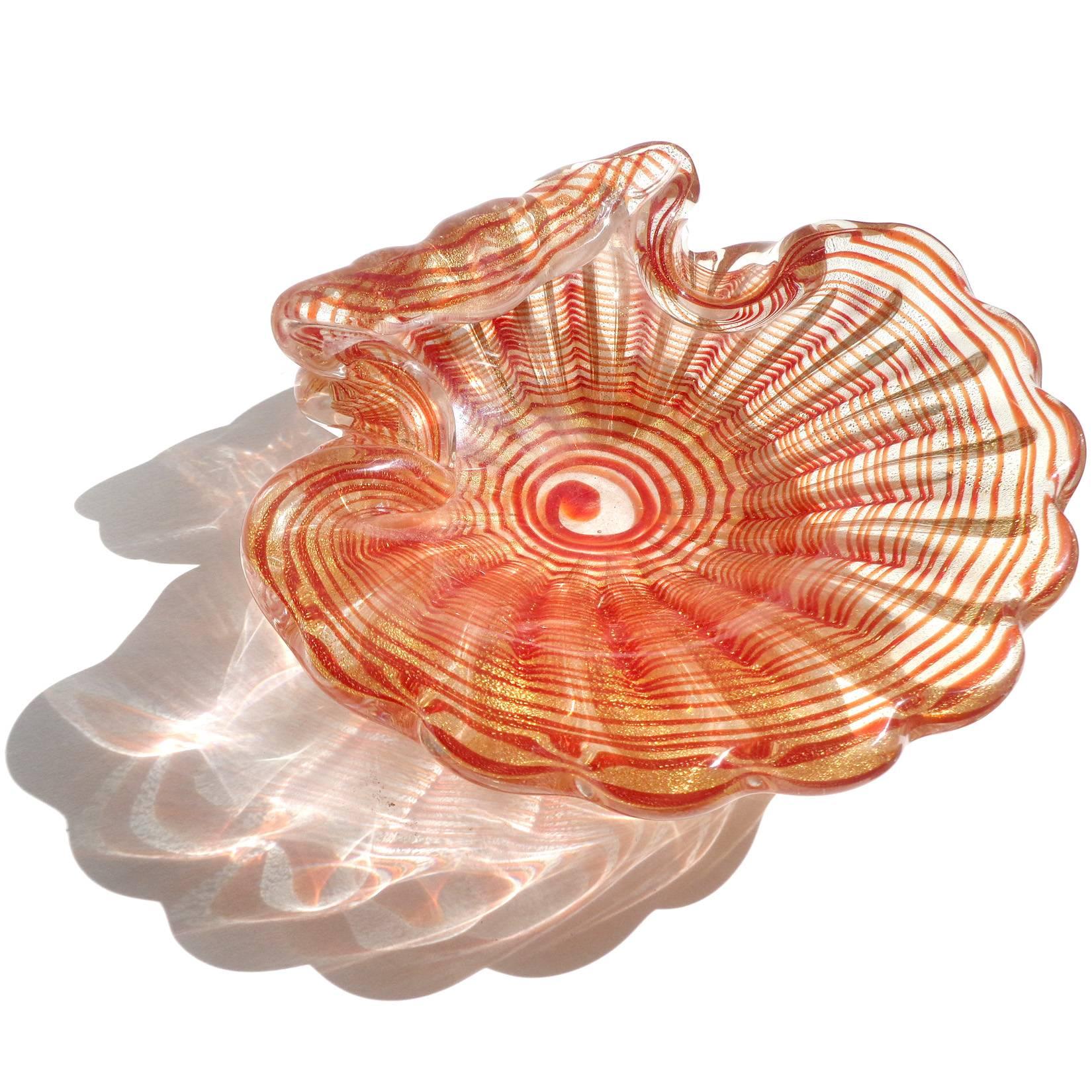 FREE Shipping Worldwide! See details below description.

Murano hand blown red optic swirl and gold flecks art glass shell shaped bowl. Attributed to the Barovier e Toso company. Just beautiful!

Please look at my exclusive 1stdibs Storefront