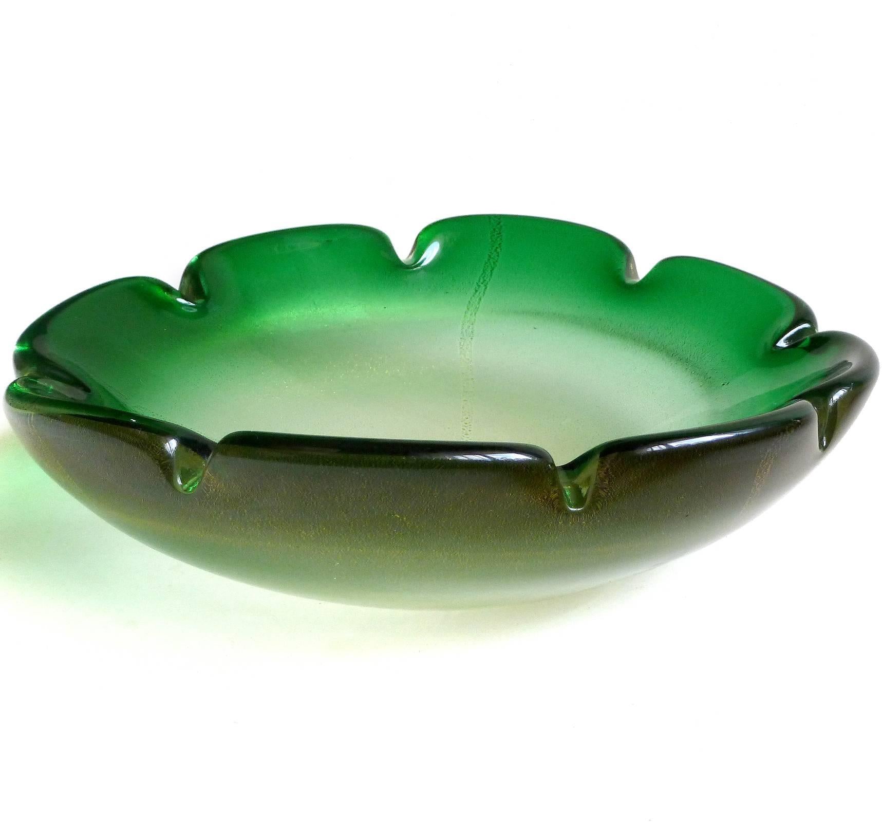 Beautiful Murano hand blown green Sommerso and gold flecks Italian art glass bowl with original label. Created in the manner of Archimede Seguso and Alfredo Barbini, circa 1950-60s. It has very heavy gold leaf. The label reads "Genuine Venetian