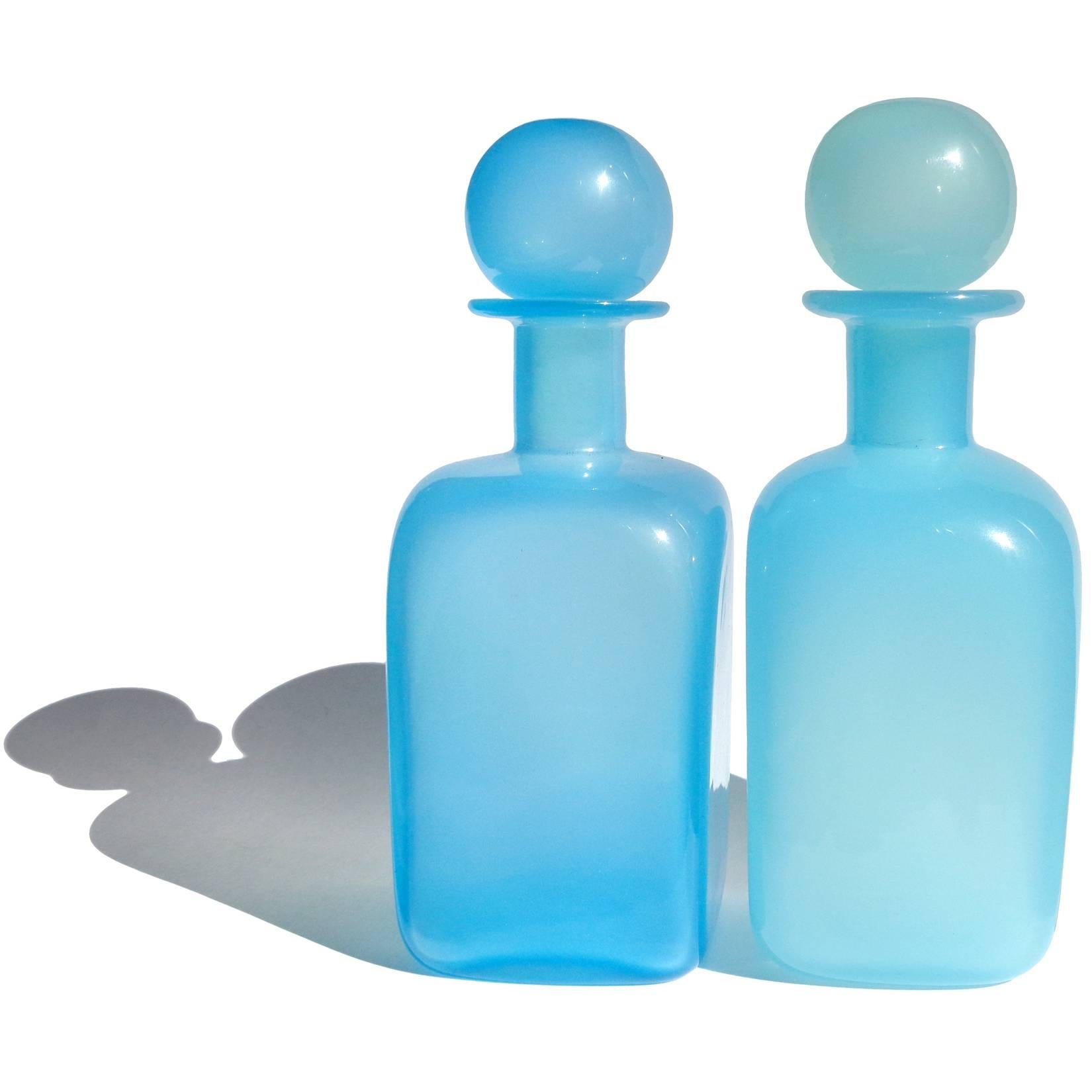 Free shipping worldwide! See details below description.

Amazing set of Murano handblown pink, green, and blue opalescent art glass decanters / bottles. Documented to designer Archimede Seguso. The green bottle has 3 original labels still