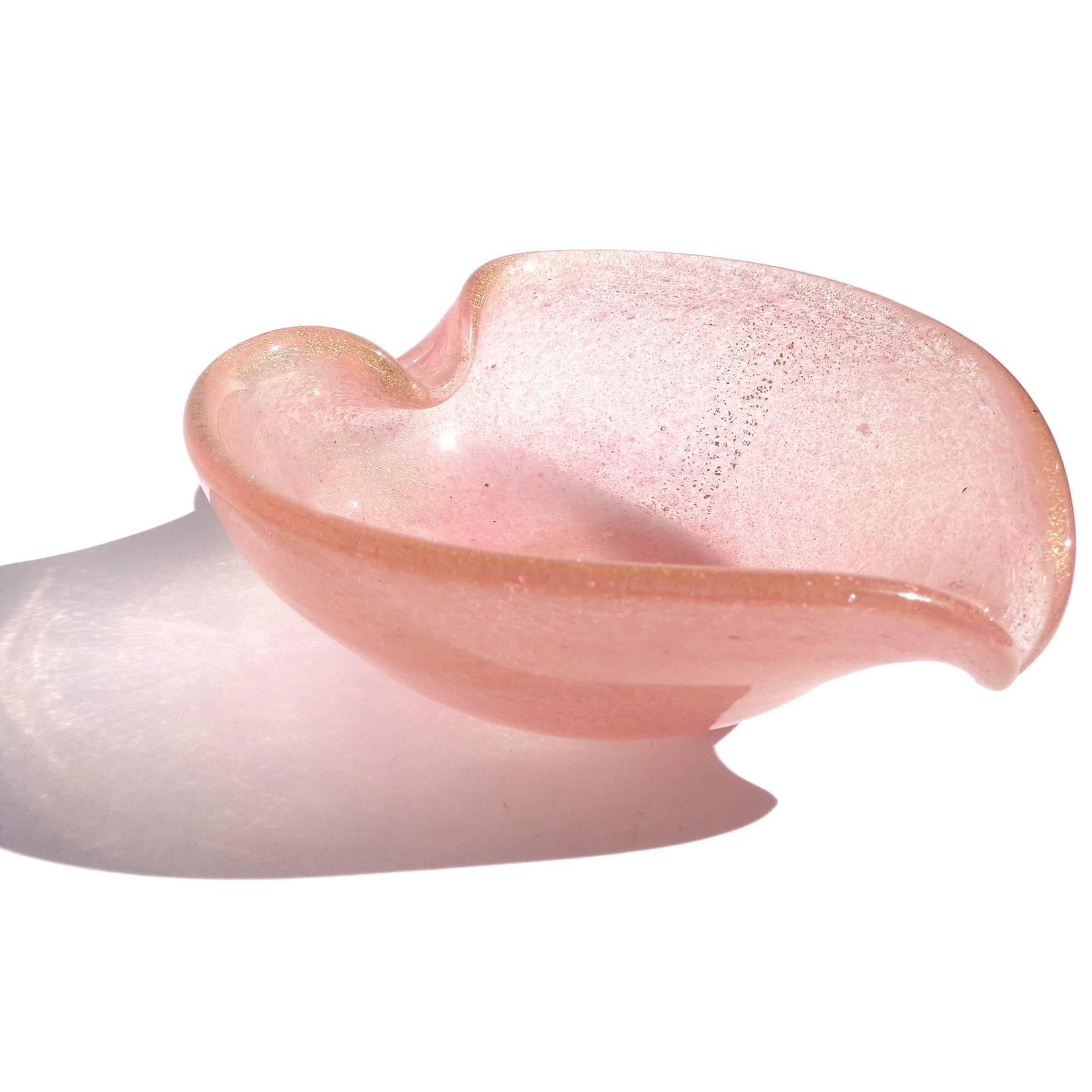Free shipping worldwide! See details below description.

Beautiful set of four Murano handblown pink and gold flecks art glass heart shaped bowls. In the manner of designers Alfredo Barbini and Archimede Seguso. The color is made of tiny spots of