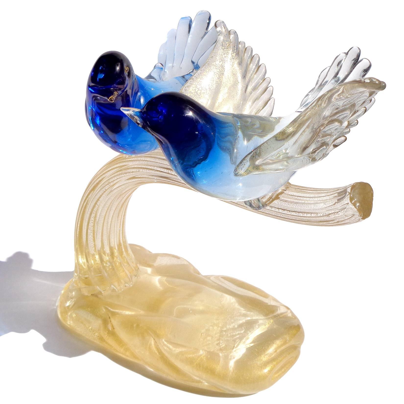 Free shipping worldwide! See details below description.

Gorgeous Murano handblown, cobalt blue Sommerso and gold flecks art glass love birds on branch. Documented to designer Alfredo Barbini. The piece is profusely covered in gold leaf, along