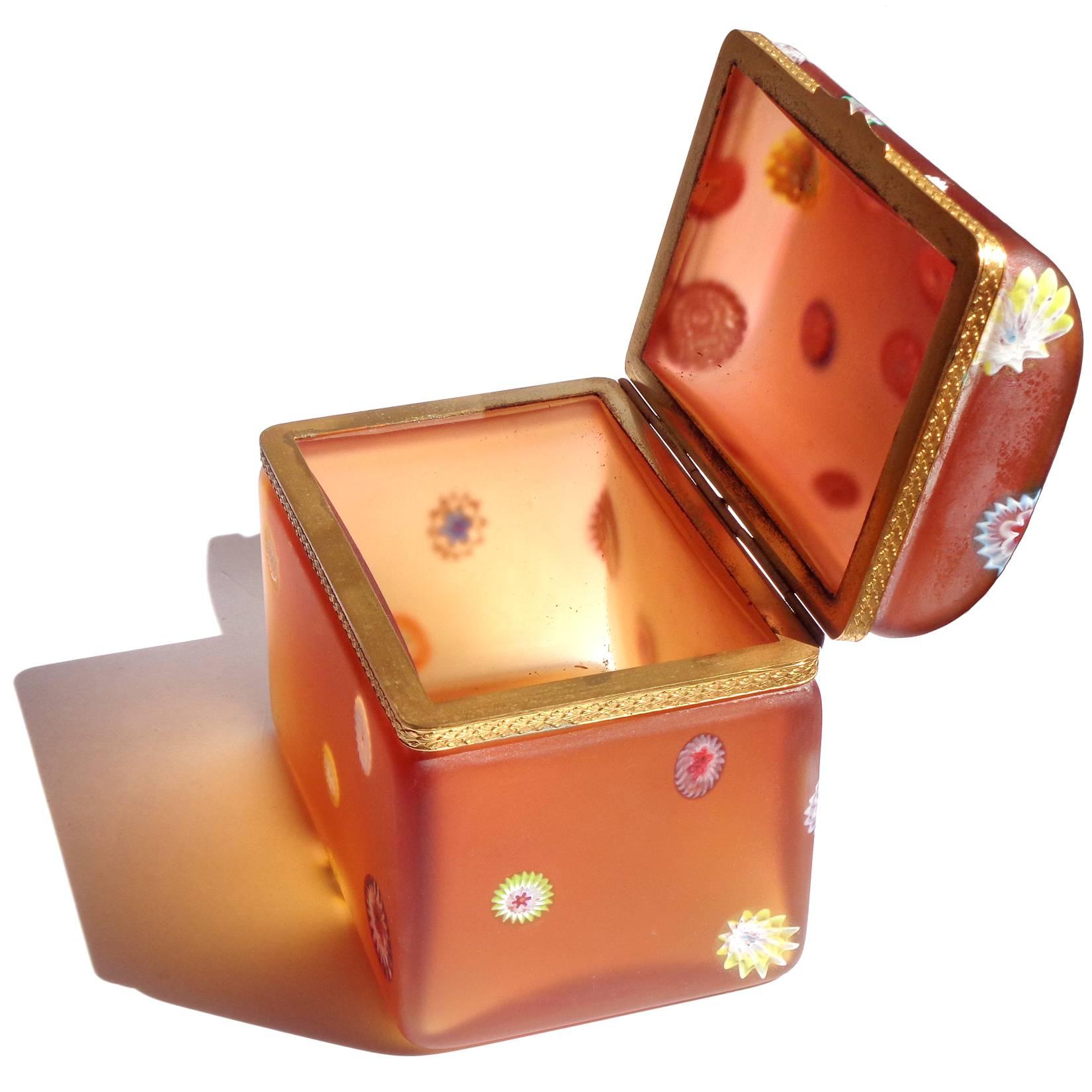Free shipping worldwide! See details below description.

Rare and beautiful Murano hand blown, millefiori flowers and satin orange art glass tall trunk / casket jewelry box. Documented to the Fratelli Toso company. Has a golden metal fittings