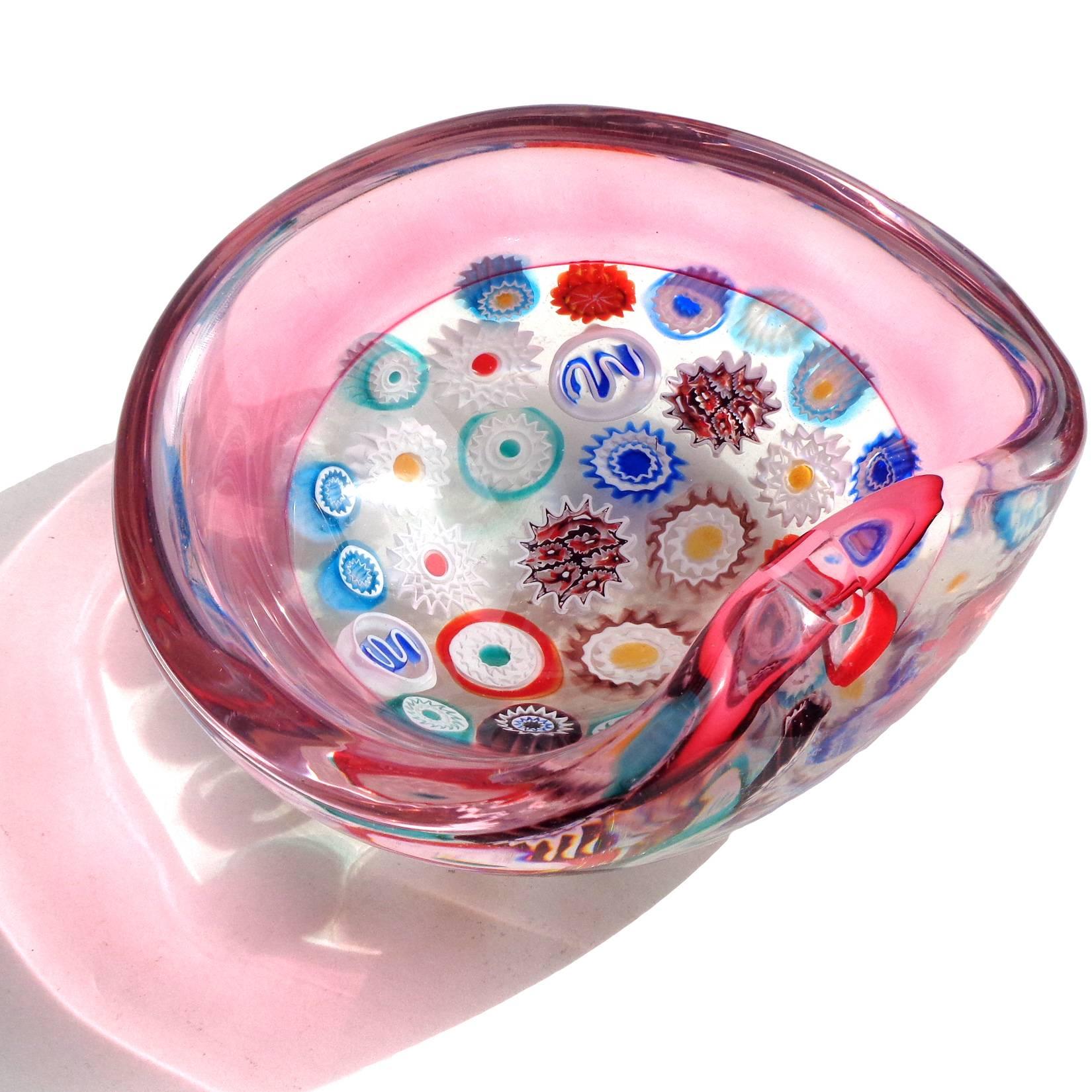 Beautiful and rare Murano hand blown Millefiori canes and Incalmo rim Italian art glass ashtray. Documented to designer Archimede Seguso. The piece has a cut indent on the rim for cigarettes. Will be listing more from my personal collection in