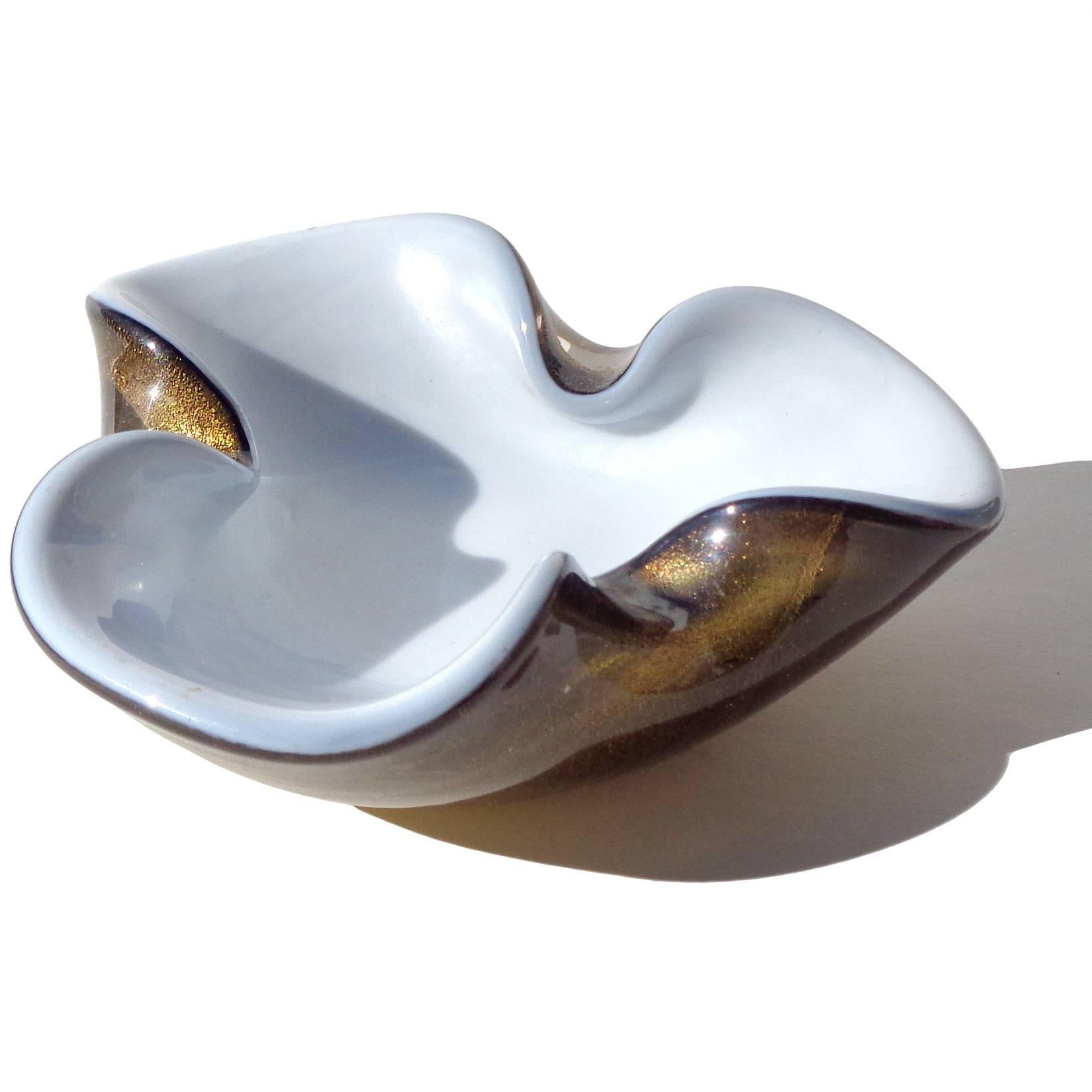 Free shipping worldwide! See details below description.

Beautiful Murano handblown pearl white, black and gold flecks art glass decorative bowl / ashtray. The piece is profusely covered in gold leaf on the outside, with iridescent surface.