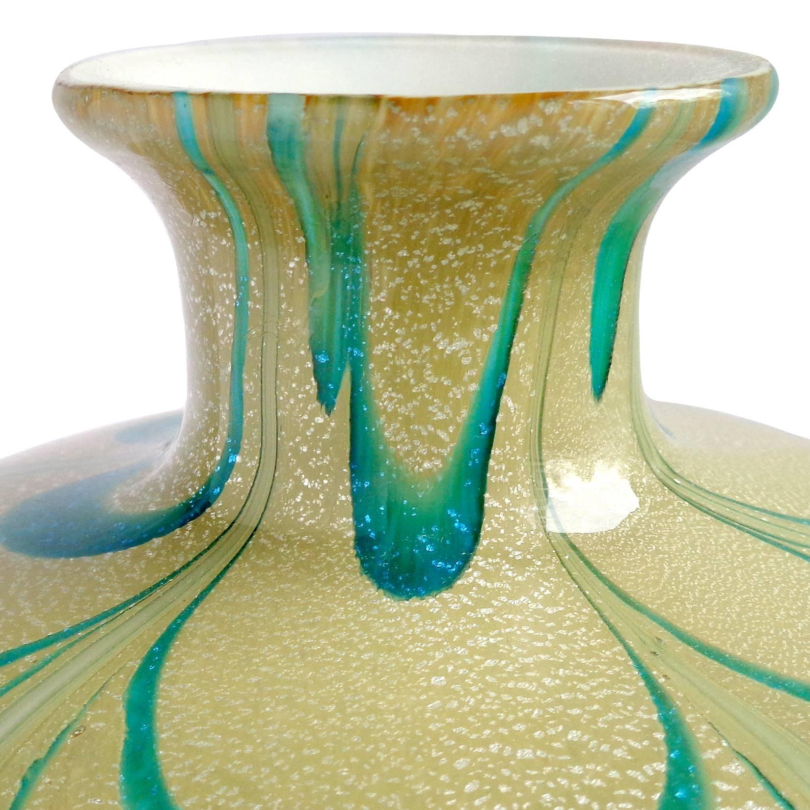Beautiful Murano hand blown silver flecks, aqua green swirl, and soft yellow Italian art glass flower vase. Attributed to designer Franco Moretti, circa 1970s. Created in the "Fenicio" or "Pulled Feather" decoration. Measures: 7