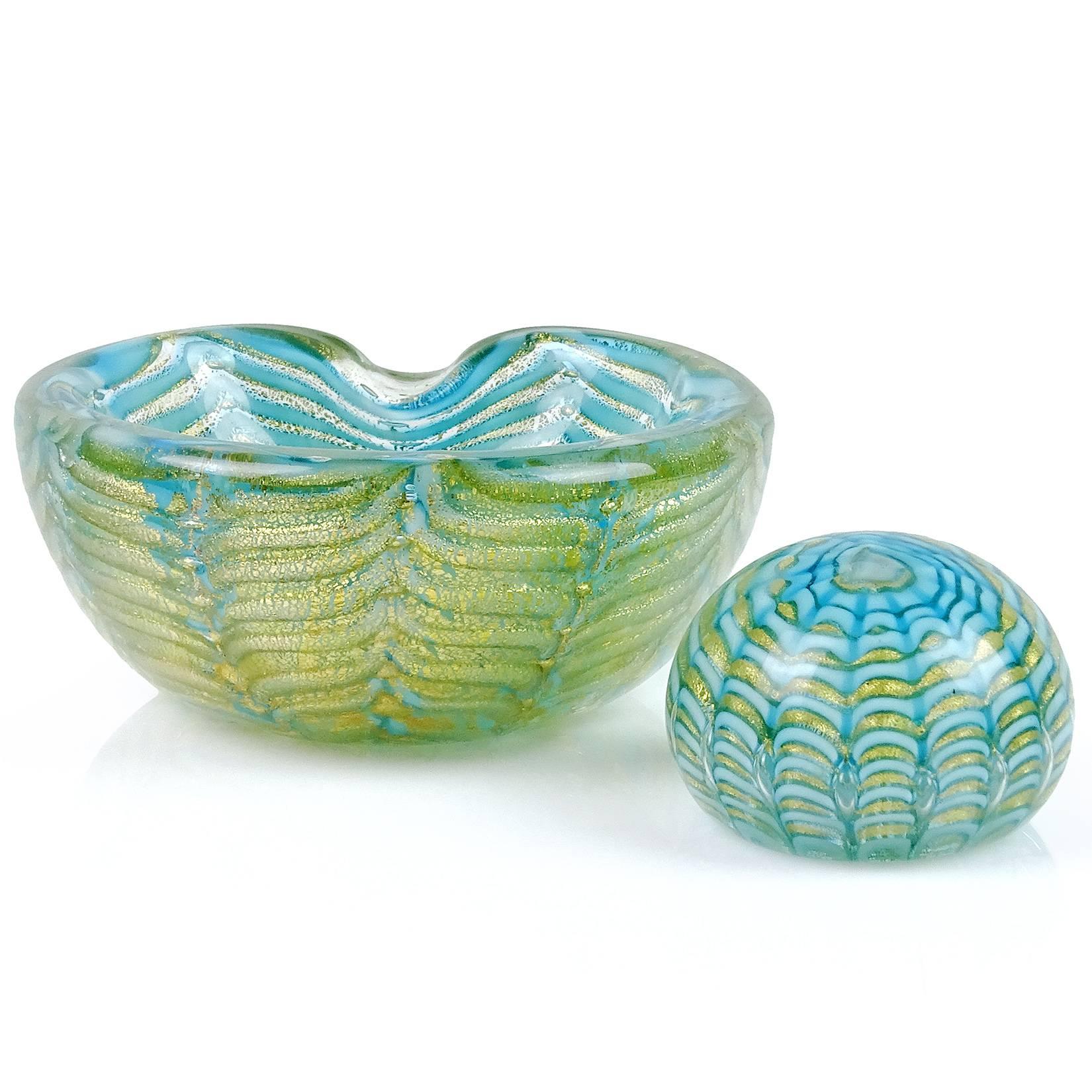 Free shipping worldwide! See details below description.

Beautiful set of Murano handblown blue and heavy gold flecks art glass bowl and paperweight set. Documented to designer Ercole Barovier for Barovier e Toso. Created in the 
