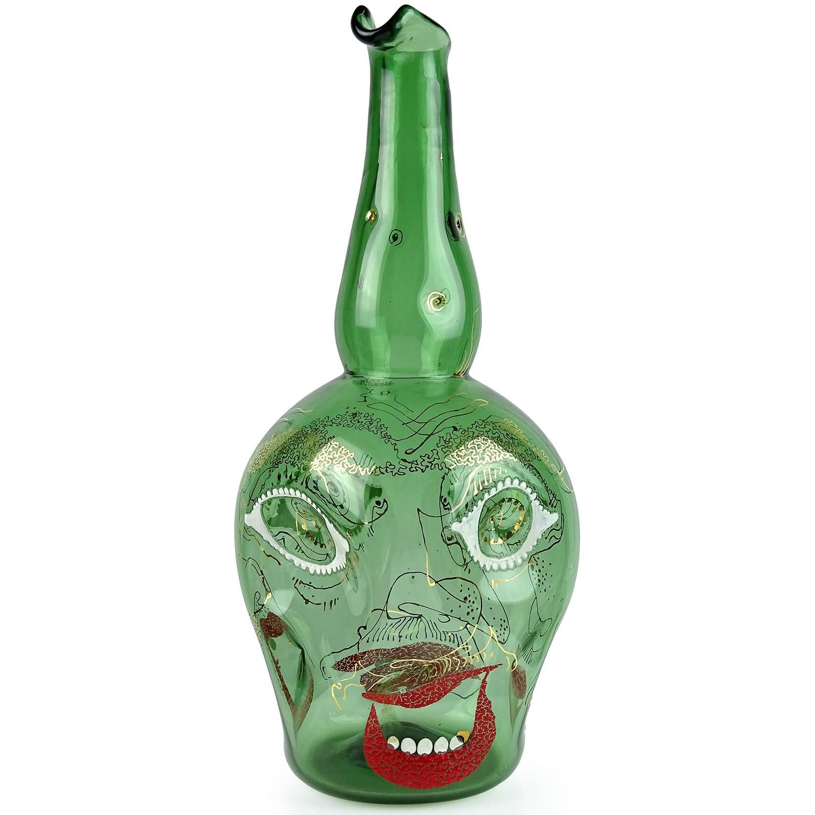 Free shipping worldwide! 

Rare Murano hand blown green Italian art glass large wine carafe or flower vase with enamel and gold gilt "Grotesque" changing faces. Documented to designer Anzolo Fuga circa 1947-1948. Similar pieces are