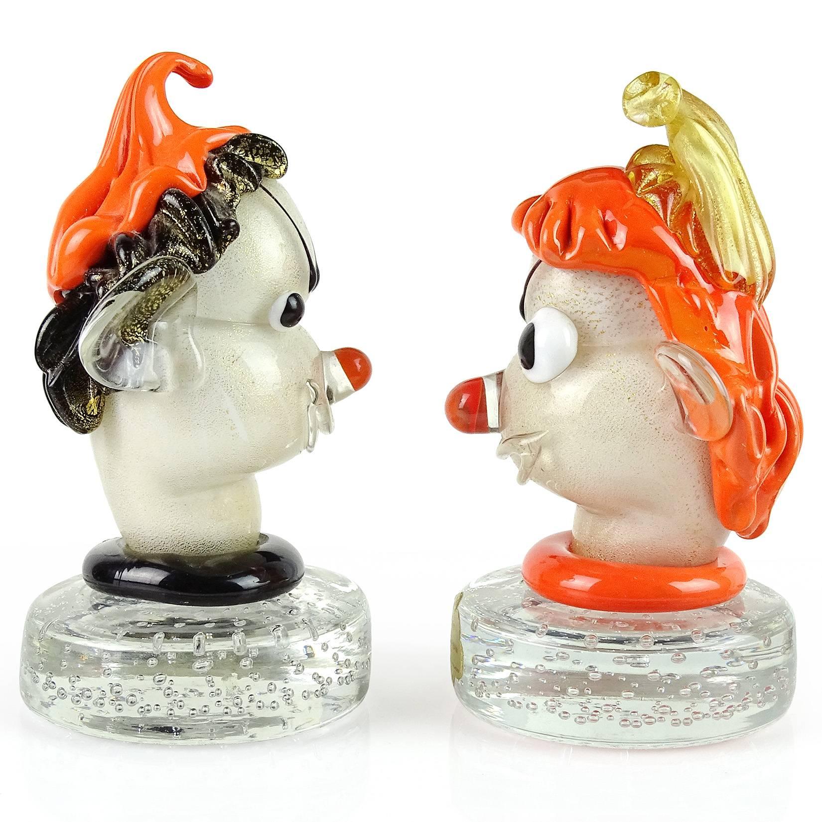 Priced per item, beautiful and cute Murano handblown orange, black, white and gold flecks Italian art glass elf head paperweights. Documented to designer Alfredo Barbini. One with original Barbini label. Very expressive little guys, with hats and