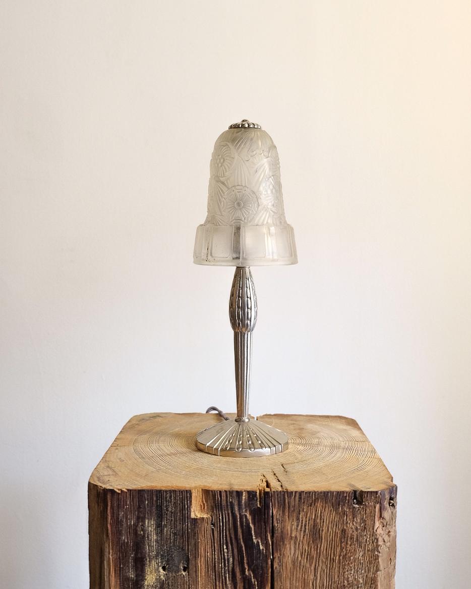 Beautiful art deco lamp with carved glass detailing. Euro wired.