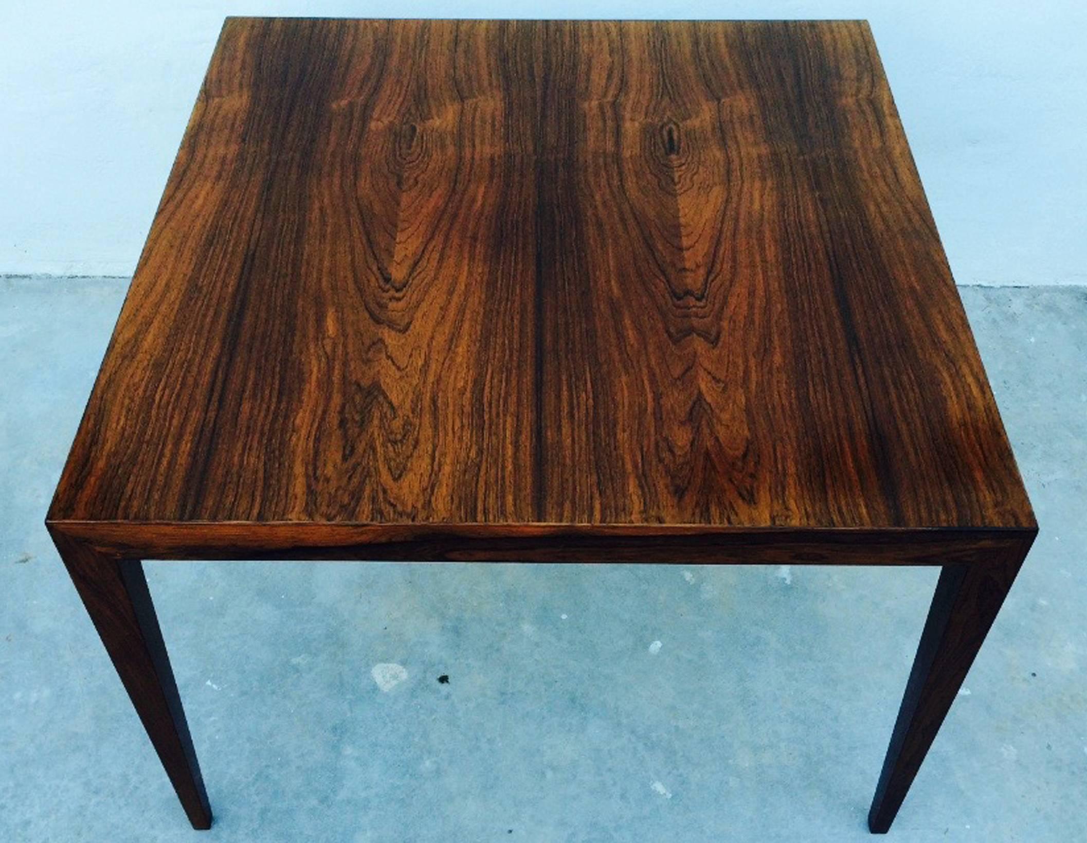 A Fine Severin Hansen rosewood cocktail table. Authentic matched veneer table top with taper legs item designed for Haslev, Denmark. Excellent with no issues.